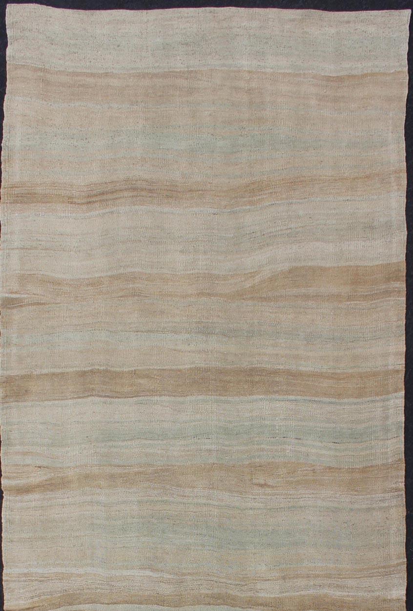 Stripe design Kilim gallery runner from Turkey. Keivan Woven Arts / rug EN-176830, country of origin / type: Turkey / Kilim, circa 1950


This lightly-colored Turkish Kilim runner is flat-woven in a Minimalist striped pattern. The colors seen