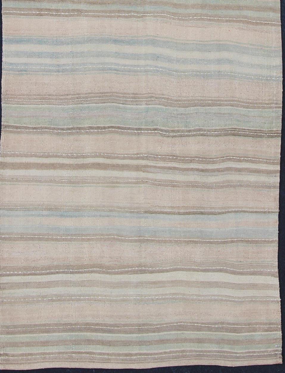 Stripe design Kilim runner from Turkey, rug en-1003, country of origin / type: Turkey / Kilim, circa 1950
striped flat-weave vintage Turkish Kilim wide runner with light colors.
This lightly-colored Turkish Kilim runner is flat-woven in a Minimalist
