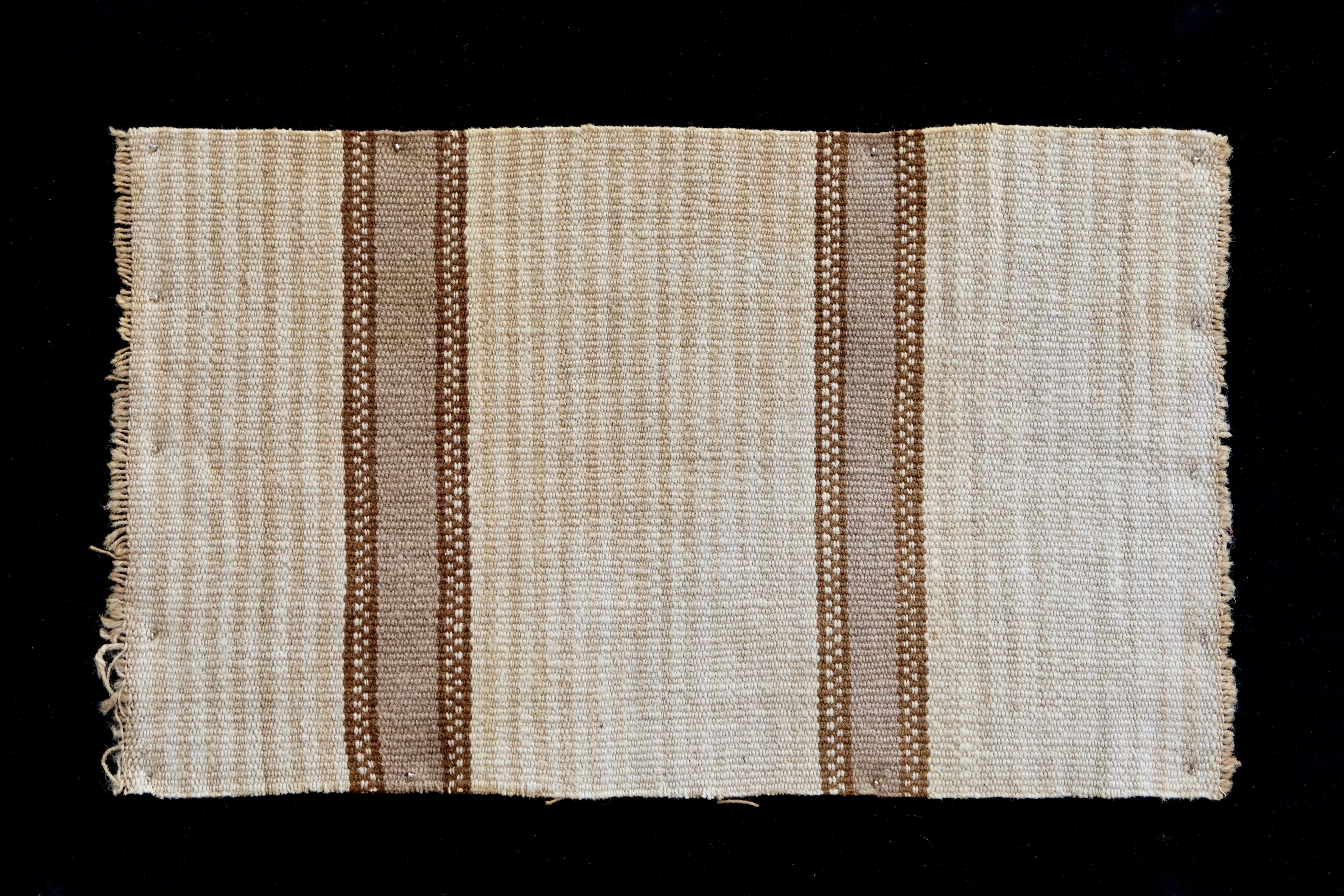 Earth tones adorn this striped pattern pre-Columbian textile.

It is a wonder to behold antiquities such as a pre-Columbian textiles, an authentic piece of art that has been preserved for centuries and that survives generation after generation.