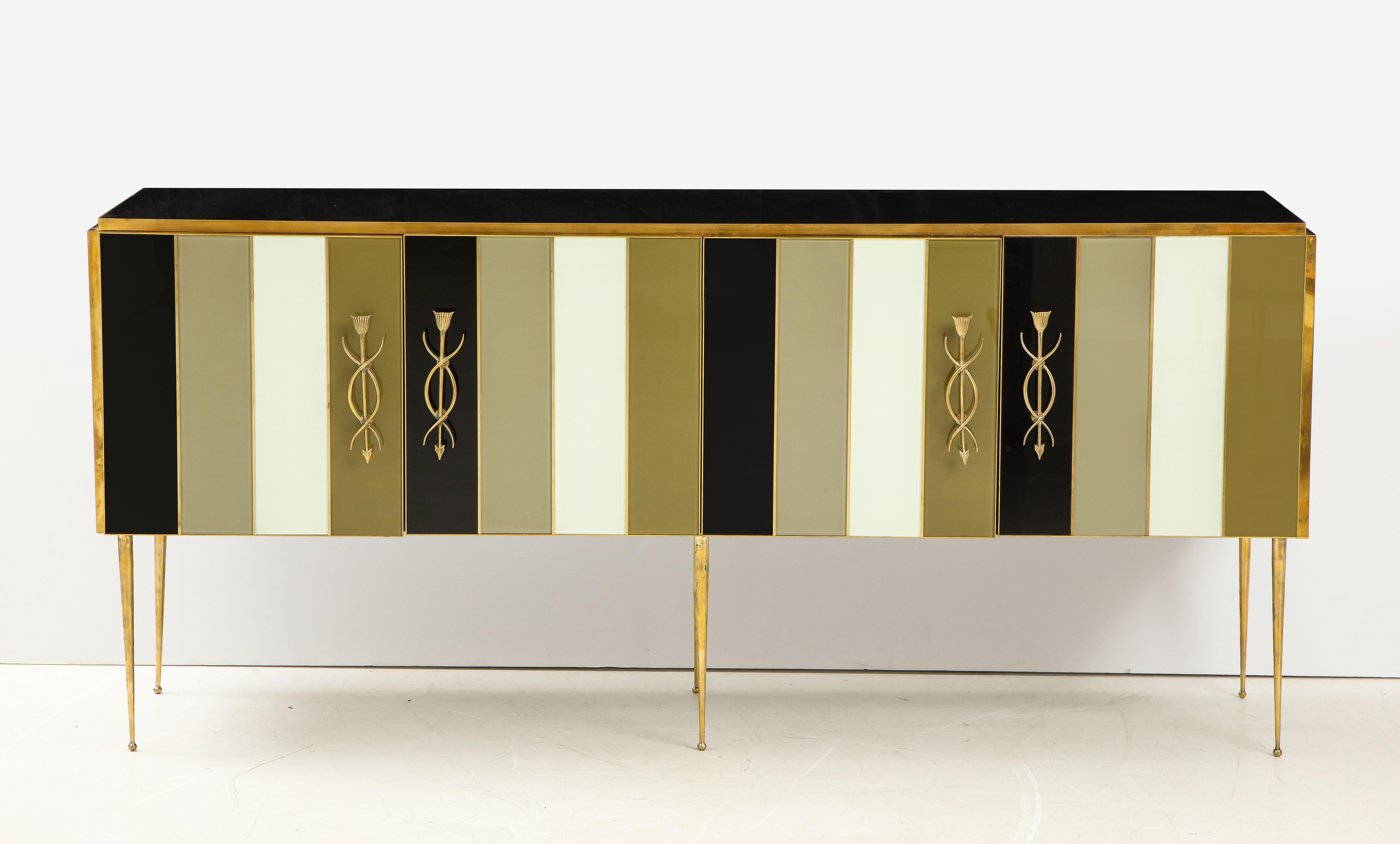 One of a kind striped black, ivory and taupe/sage green tinted glass sideboard or credenza with brass inlays handmade in Italy by a master artisan and artist. Wooden frame is veneered with tinted glass panels in alternating colors of black, ivory,