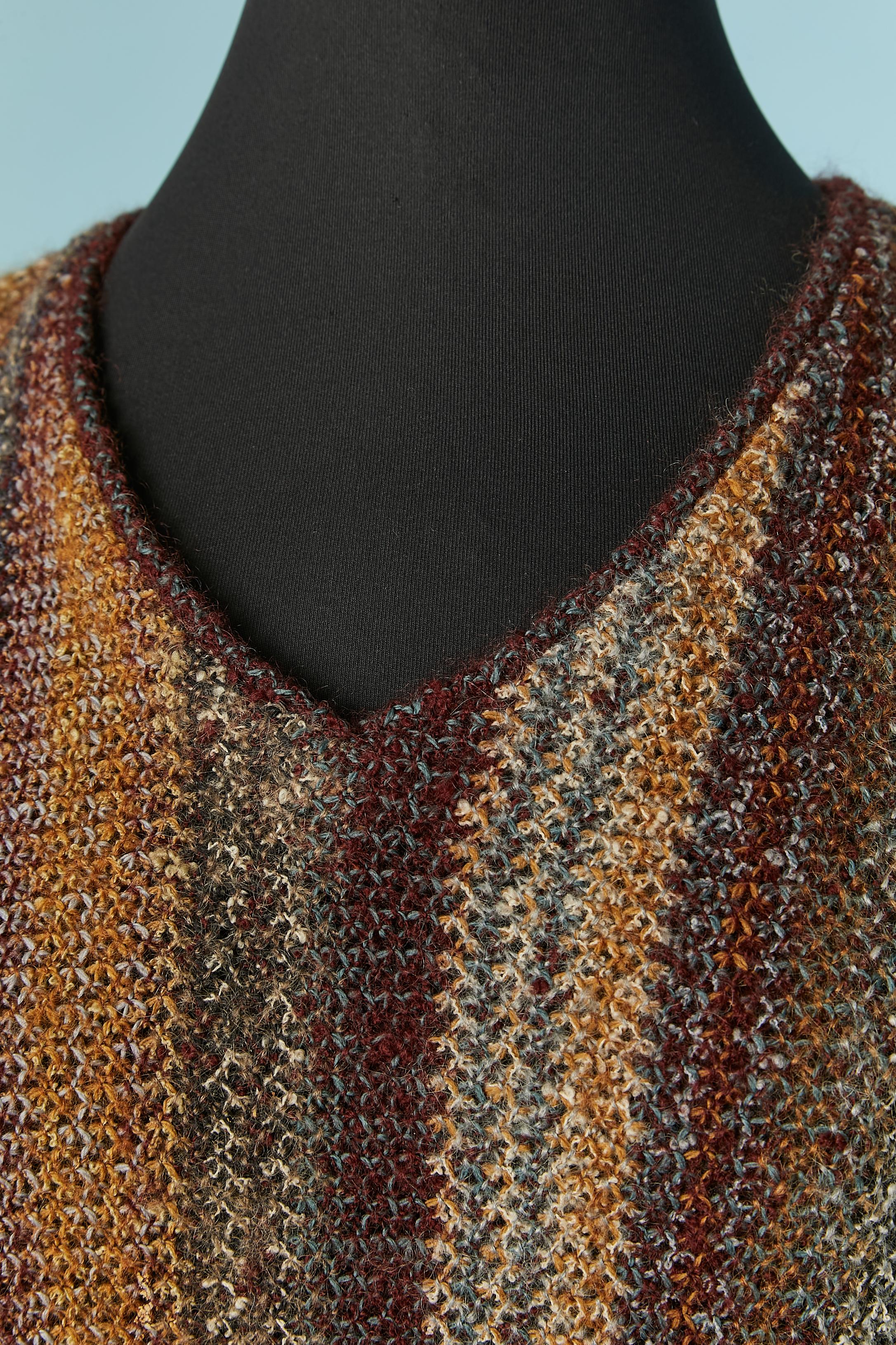Gestreiftes Jacquard-Kleid aus Chiné-Strick . Kein Etikett für die Stoffzusammensetzung, aber wahrscheinlich Wolle. 
Tasche auf beiden Seiten. 
GRÖSSE L