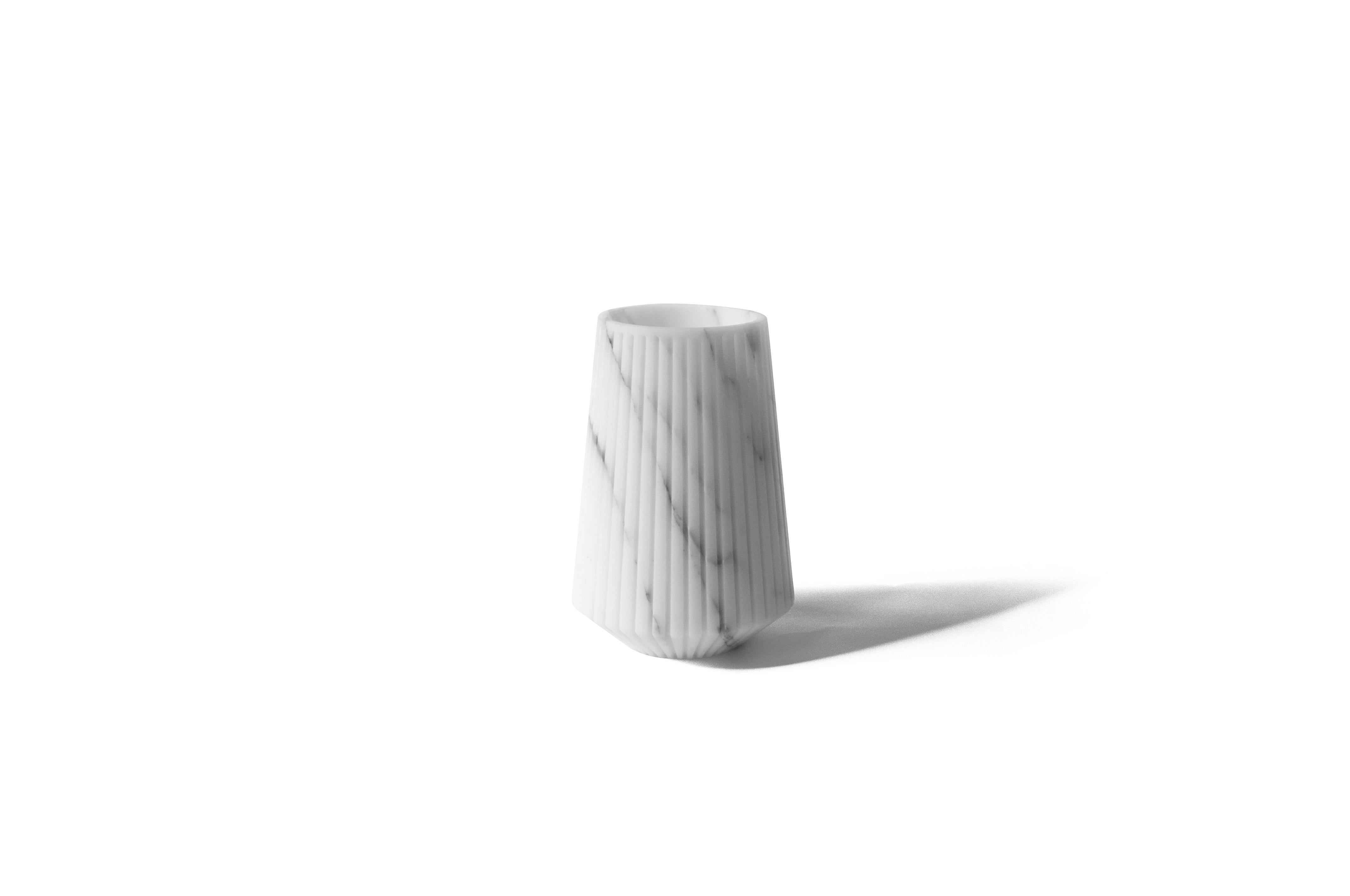 Striped medium vase in white Carrara marble.
-Jacopo Simonetti design for FiammettaV-
Each piece is in a way unique (every marble block is different in veins and shades) and handmade by Italian artisans specialized over generations in processing