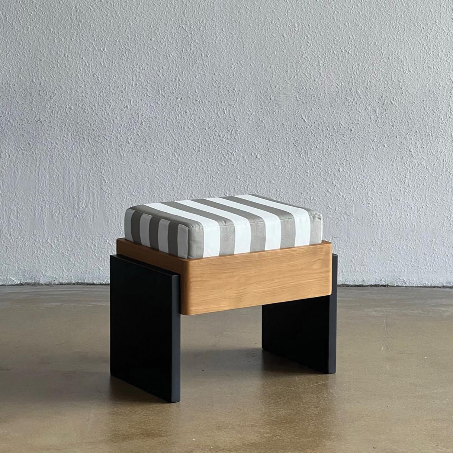 Striped Ottoman by Studio Kallang
Dimensions: W 56 x D 40 x H 47 cm
Materials: Solid Teak, Upholstered Cushion. 
Finish: Natural, Matte Black, Striped Fabric.

STUDIO KALLANG IS A SINGAPORE AND SEATTLE BASED PROJECT FOCUSING ON OBJECTS DESIGNED BY