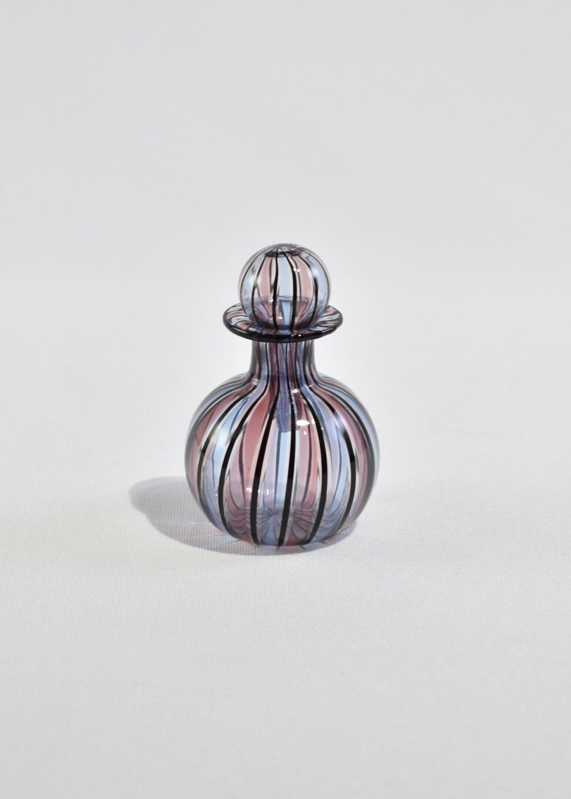 Vintage petite blown glass perfume bottle with colorful stripe detail. ?Made in Murano, Italy.
 