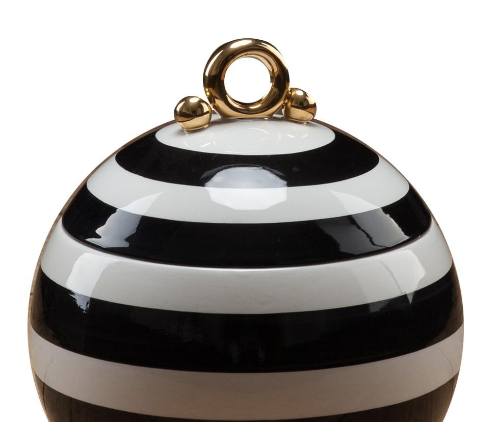 This elegant box is perfect for storing jewelry or other small precious items and it will sit perfectly on a dresser in a bedroom or on a table in an entry way. It was entirely crafted by hand in white ceramics. Black stripes were added to its
