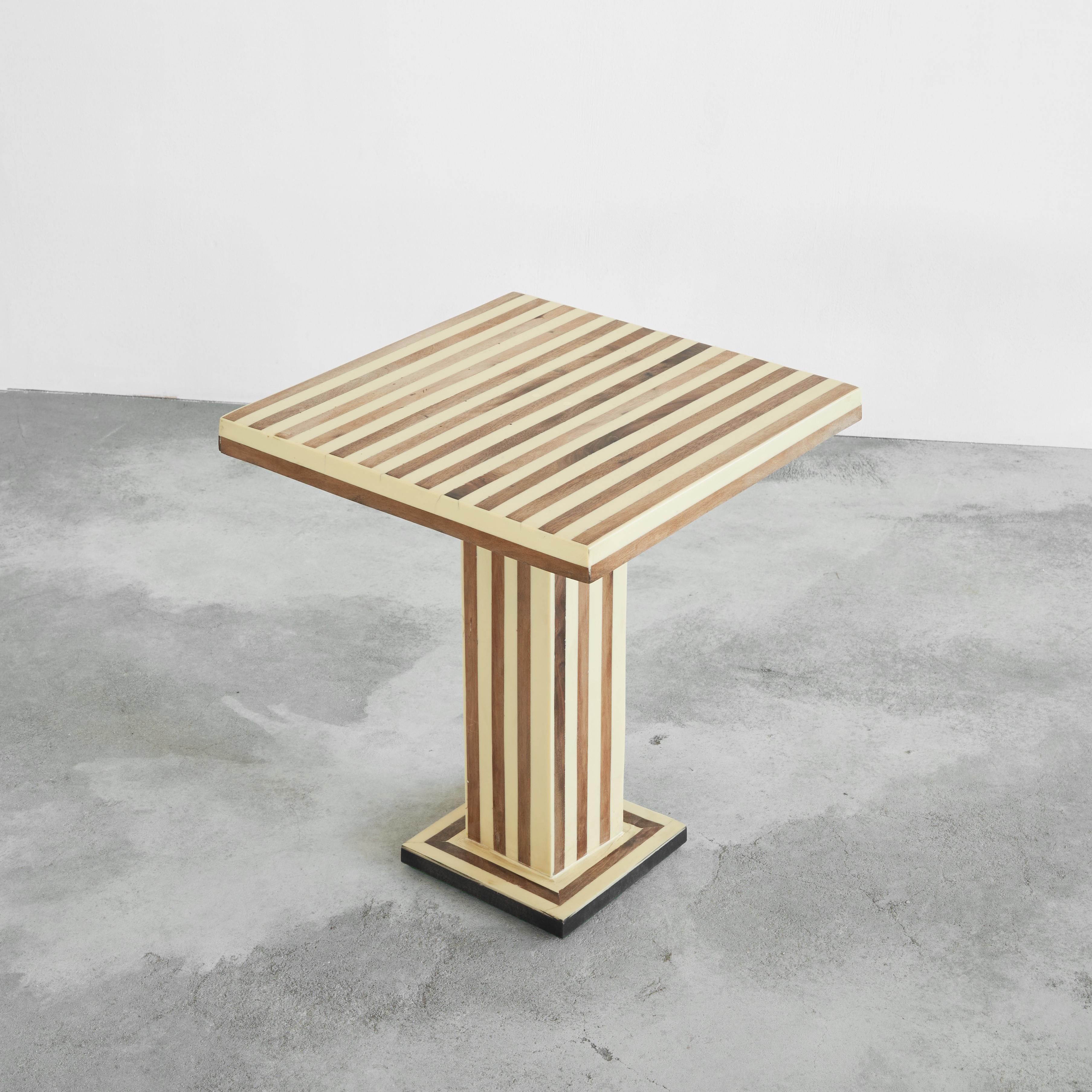 Striped Side Table in Walnut and Resin, Europe, 1970s.

This is a unique hand made table in walnut and resin, made by a craftsman at home probably somewhere in the 1970s. Great graphical design with stripes of walnut and resin. Very elegant and