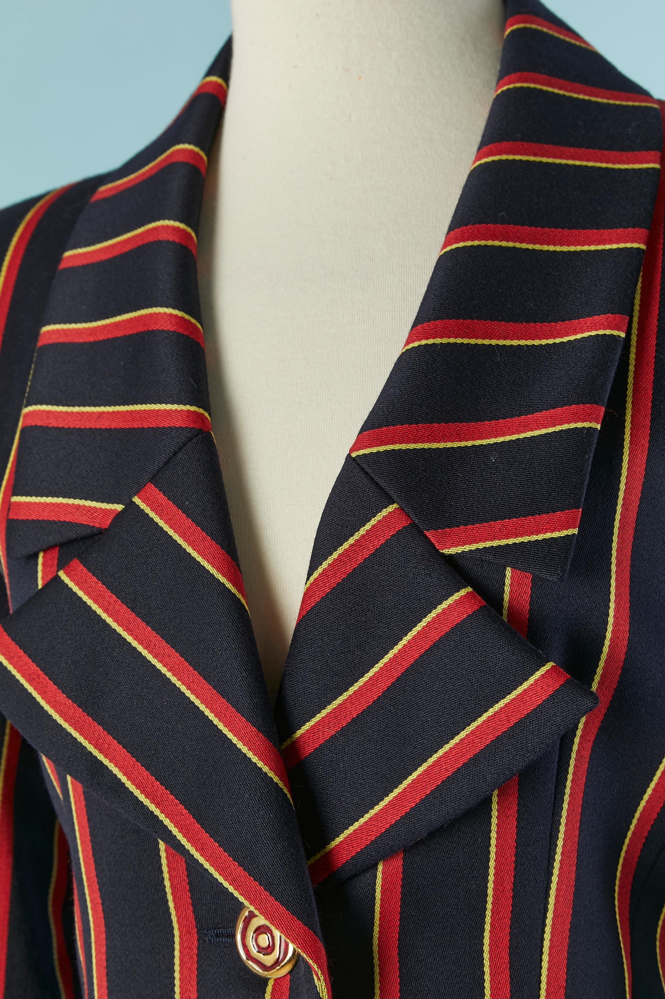 Striped thin wool skirt suit . No fabric composition tag but probably acetate or rayon. 
Shoulder pad. Button and buttonhole closure on the middle front.Pocket on both side. 
SIZE OF THE JACKET: 36 on tag but fit more likely 38 (Fr) M 
SIZE OF THE