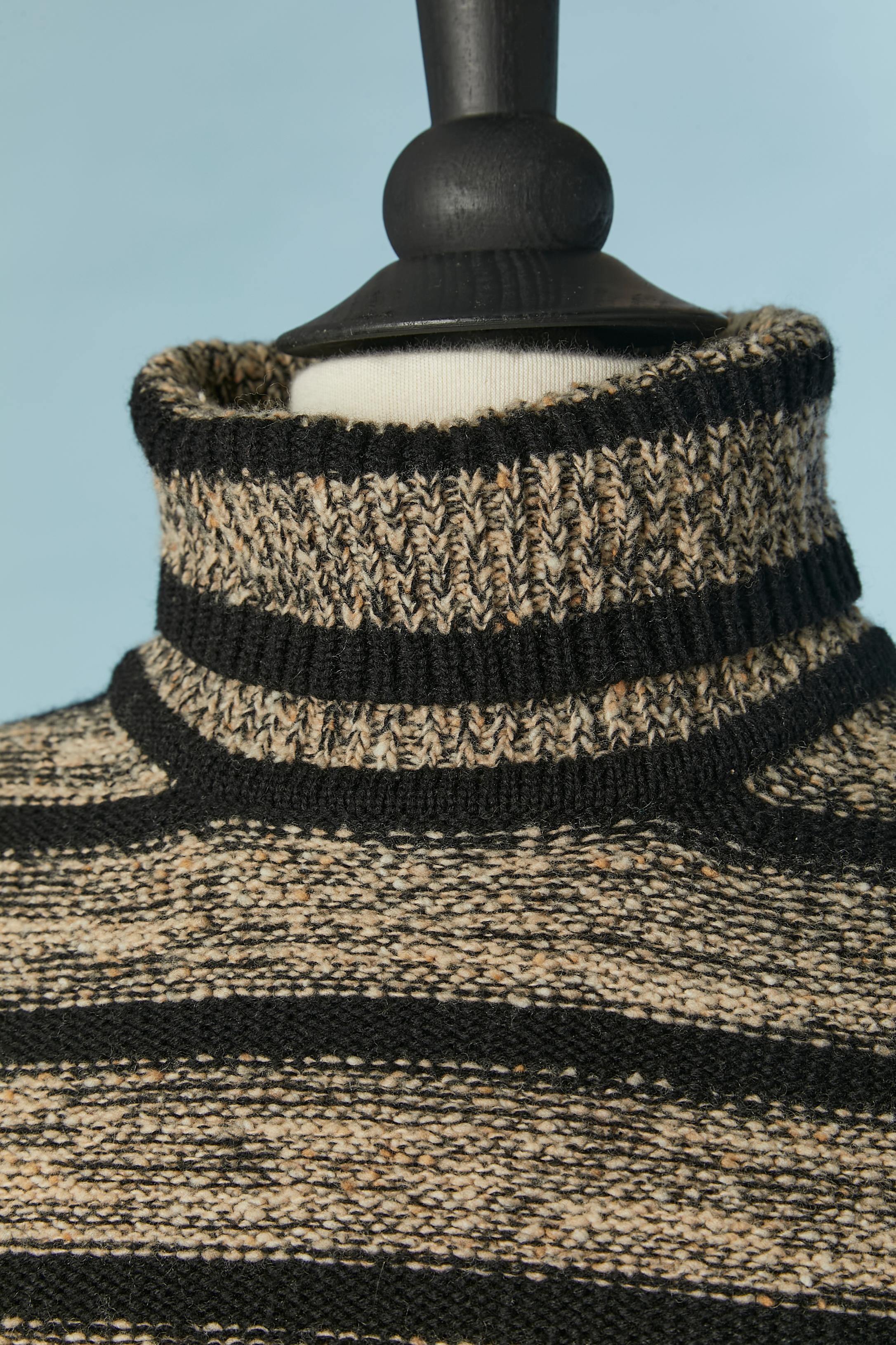 Striped sweater with turtle neck. No fabric tag composition but probably wool mix with a bit of cashmere. 
SIZE 40 / M 