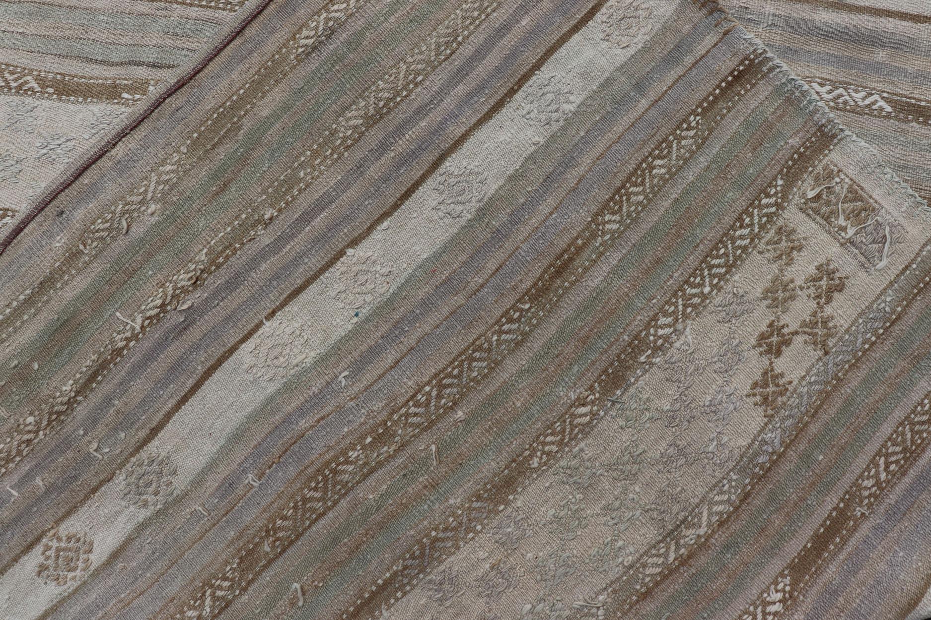 Wool Striped Turkish Flat-Weave Kilim in Muted Colors and Tribal Motifs For Sale