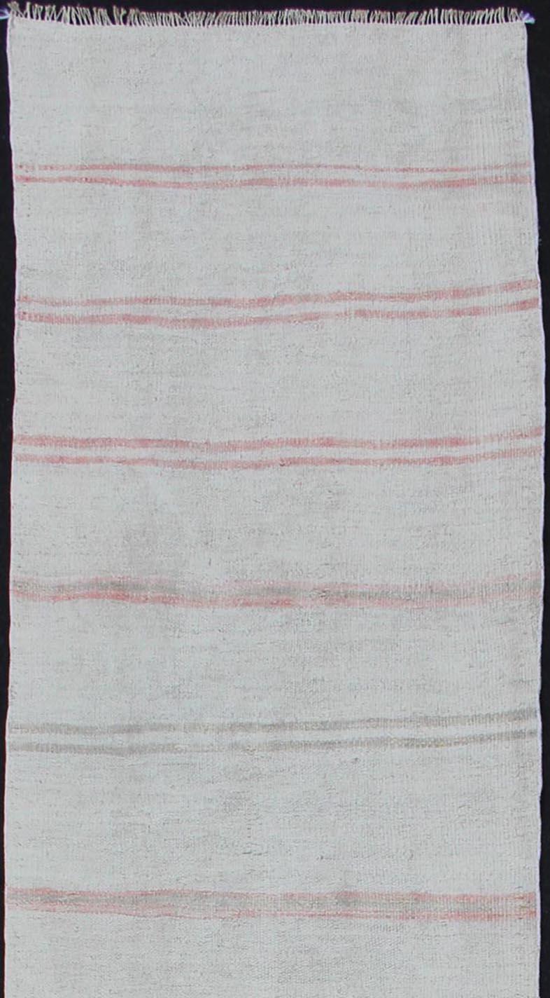 Cream and soft red vintage Kilim from Turkey with Minimalist design in stripes, Keivan Woven Arts / rug TU-NED-1209, country of origin / type: Turkey / Kilim, circa 1950

This vintage striped design Kilim from Turkey rendered in shade of soft red