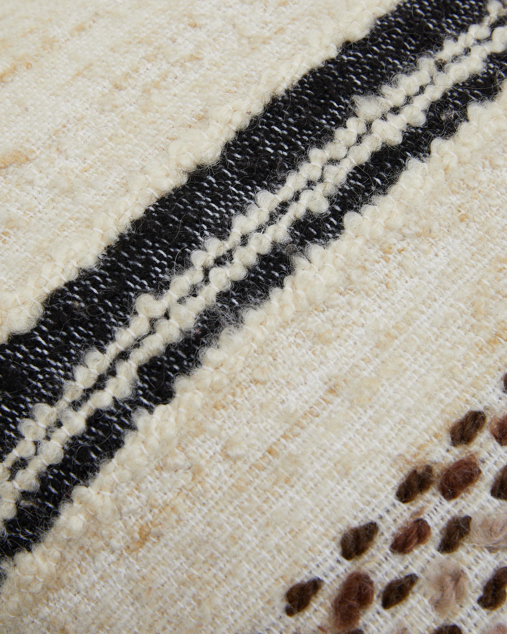Striped pillow BIBA made from curated vintage Scandinavian wool fabric in Cream, Beige, Brown colors. The fabric have mixed textures. 
Every pillow is unique. 
Size: 60x50cm
Handmade in Sweden.

Composition front: Vintage wool. Made in