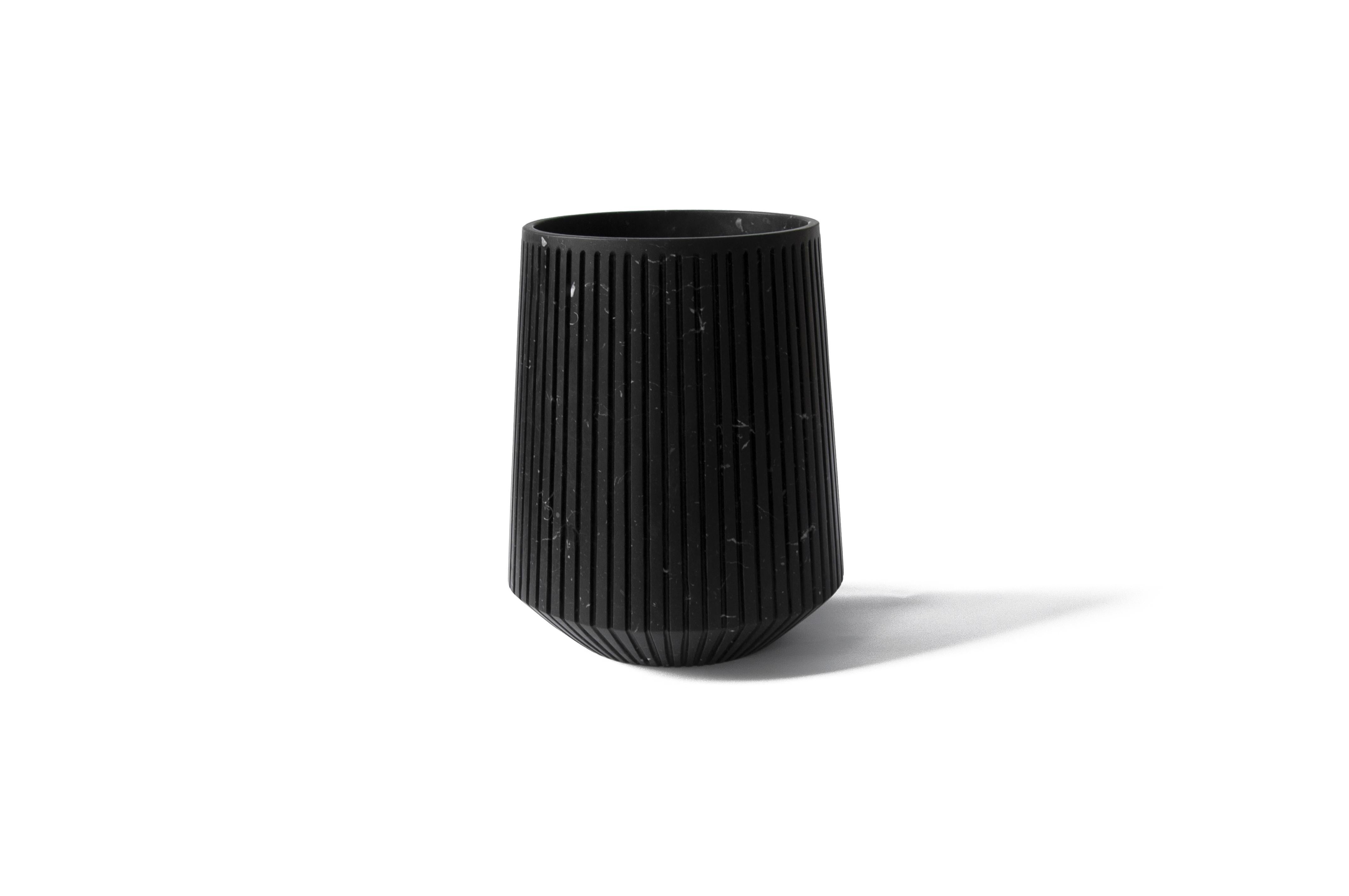 Striped wide vase in black Marquina marble.
-Jacopo Simonetti design for FiammettaV-
Each piece is in a way unique (every marble block is different in veins and shades) and handmade by Italian artisans specialized over generations in processing