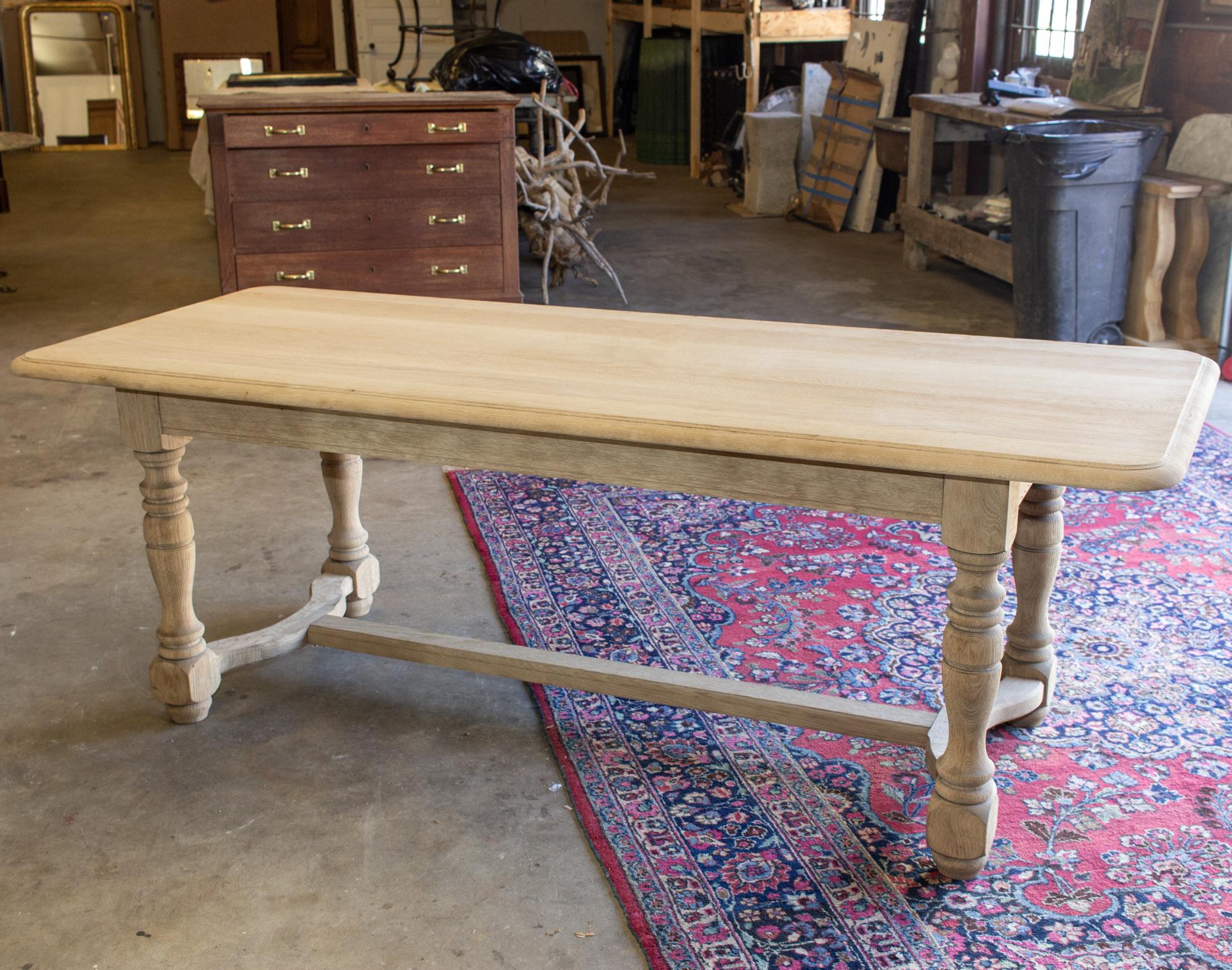 Hand-Carved Stripped Antique French Oak Table with Hand Carved Details and Beveled Edge Top