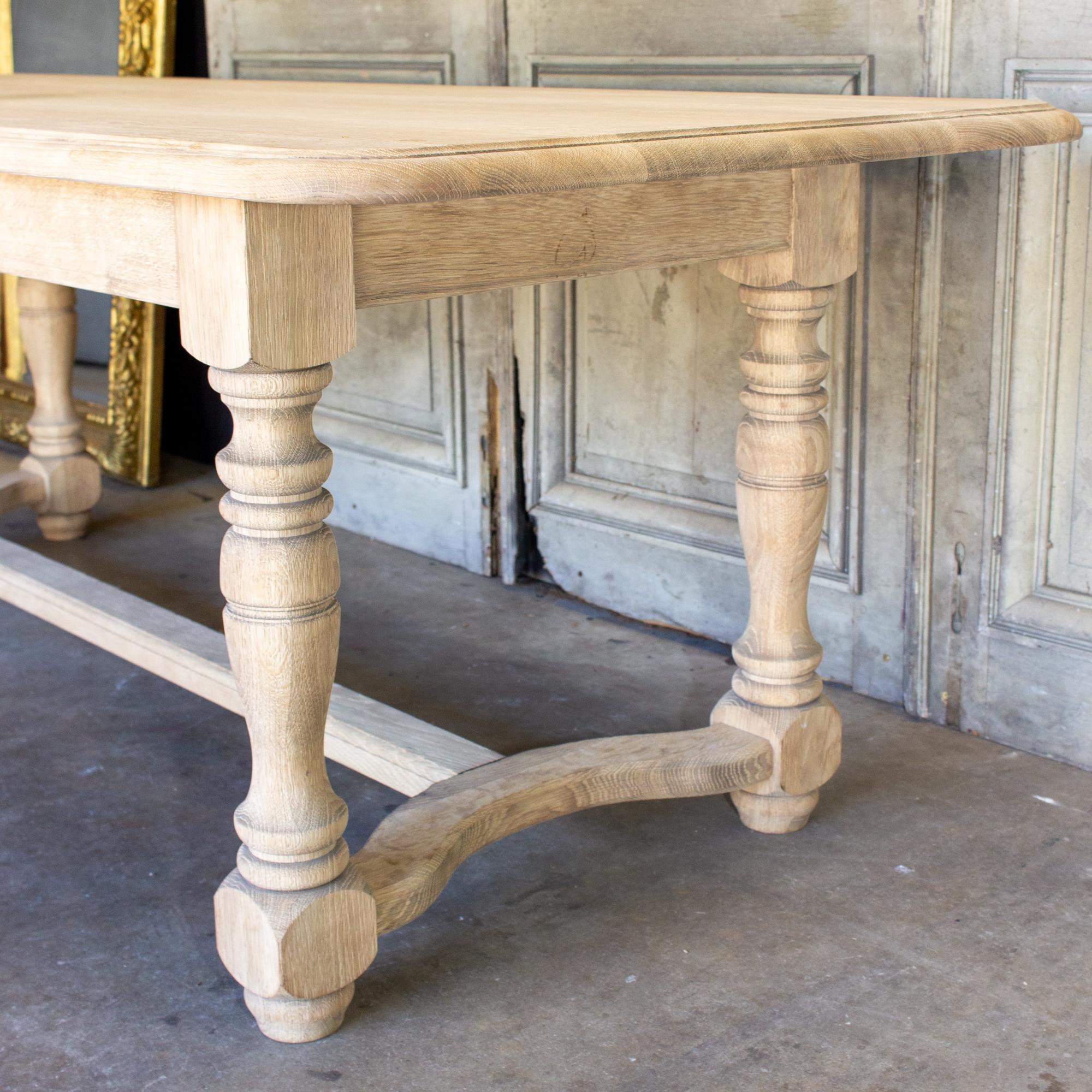 Stripped Antique French Oak Table with Hand Carved Details and Beveled Edge Top In Good Condition In Houston, TX
