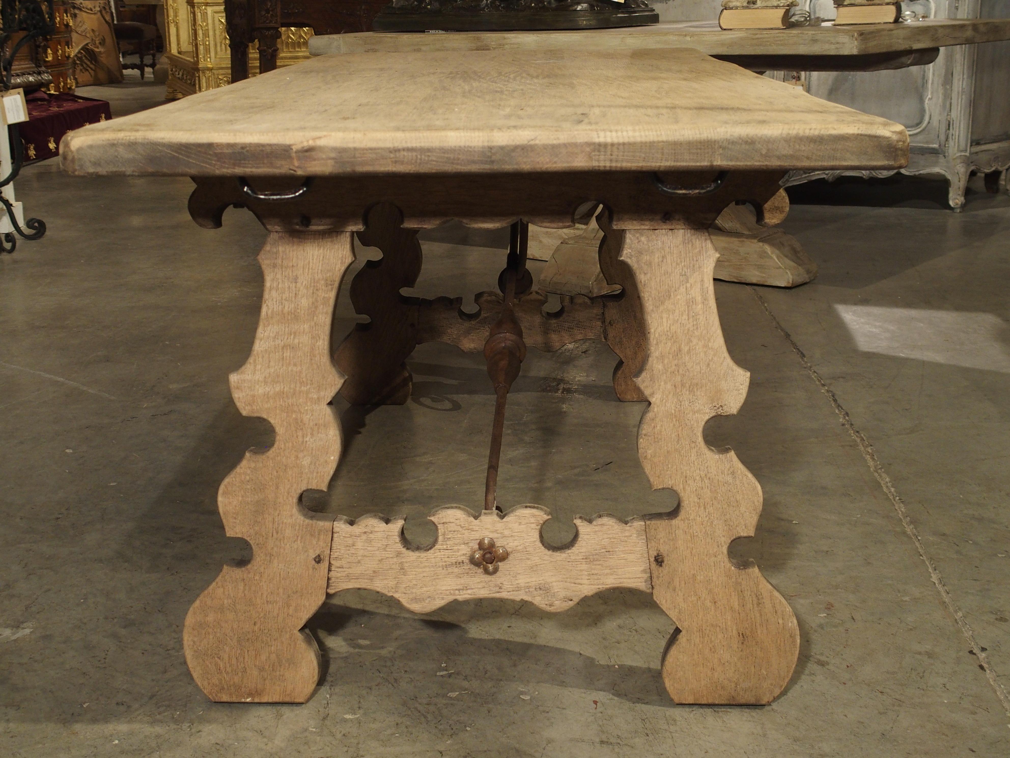Stripped Oak Dining Table with Wrought Iron Stretchers from Spain, 20th Century In Good Condition In Dallas, TX