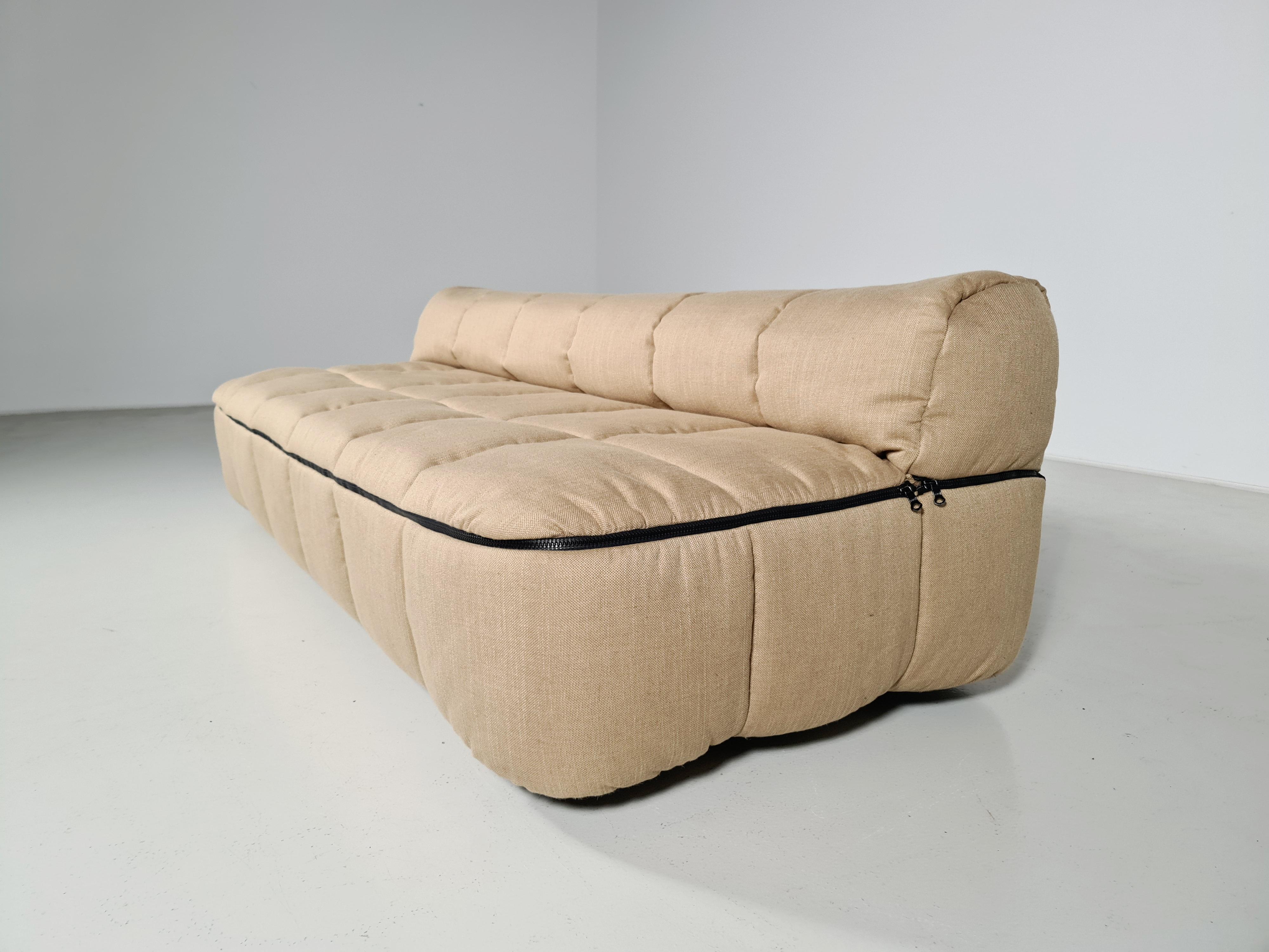 Strips sofa bed designed by Cini Boeri for Arflex in the late 60s. Can be used as a sofa and can be converted into a single bed. Removable fabric cover. Reupholstered in a fabric made of recycled yarns. One of the most famous products of Arflex.