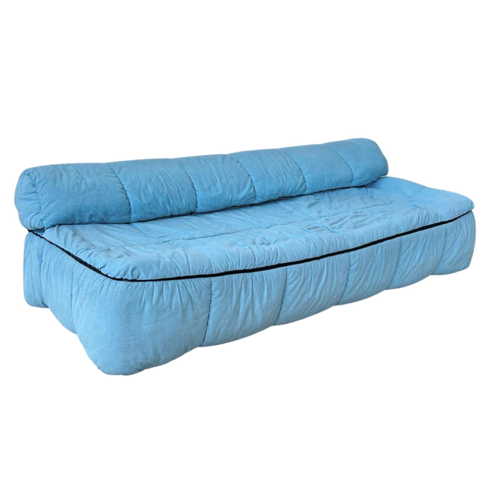 Designed by Cini Boeri for Arflex in the 1970s, the ‘Strips’ sofa is a standout of postwar Italian design. Its padded shell wraps the entire frame, creating a relaxed, sculptural silhouette. Upholstered in the original light blue textile with
