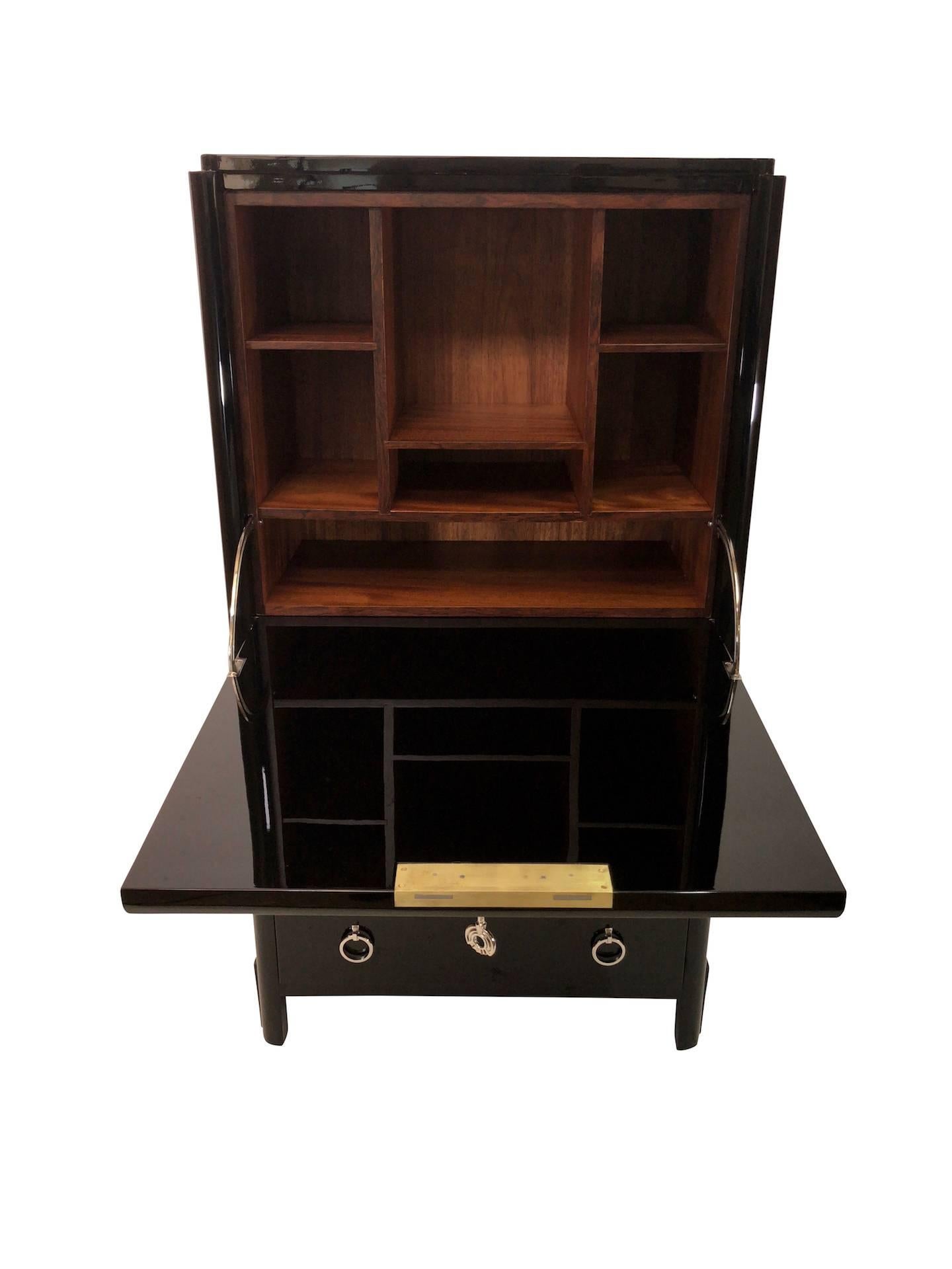 Strong bureau with drawers
Original Art Deco, France, 1930s

High quality restoration
Black piano lacquer
Fresh nickelled fittings

Dimensions:
Width 70 cm
Height 130 cm
Depth 36 cm.