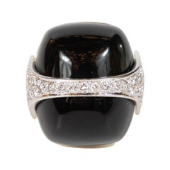 Strong and Bold 1970s La Triomphe Black Onyx Diamond Gold Ring