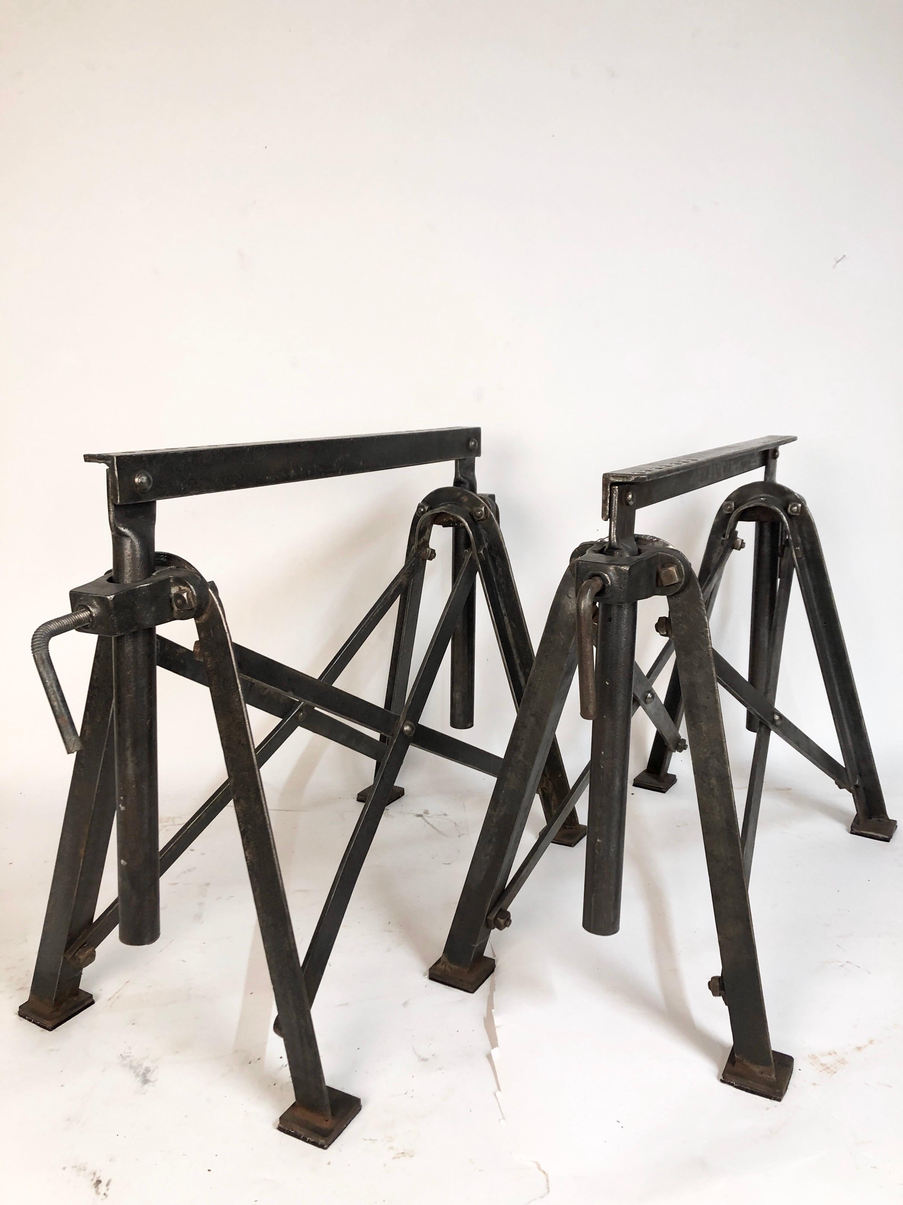A pair of unusual home made antique steel table base saw horses. Most likely made by a steel worker or machinist. Great design. Very strong and can easily support practically any table top. these have been stripped and cleaned. Made between the