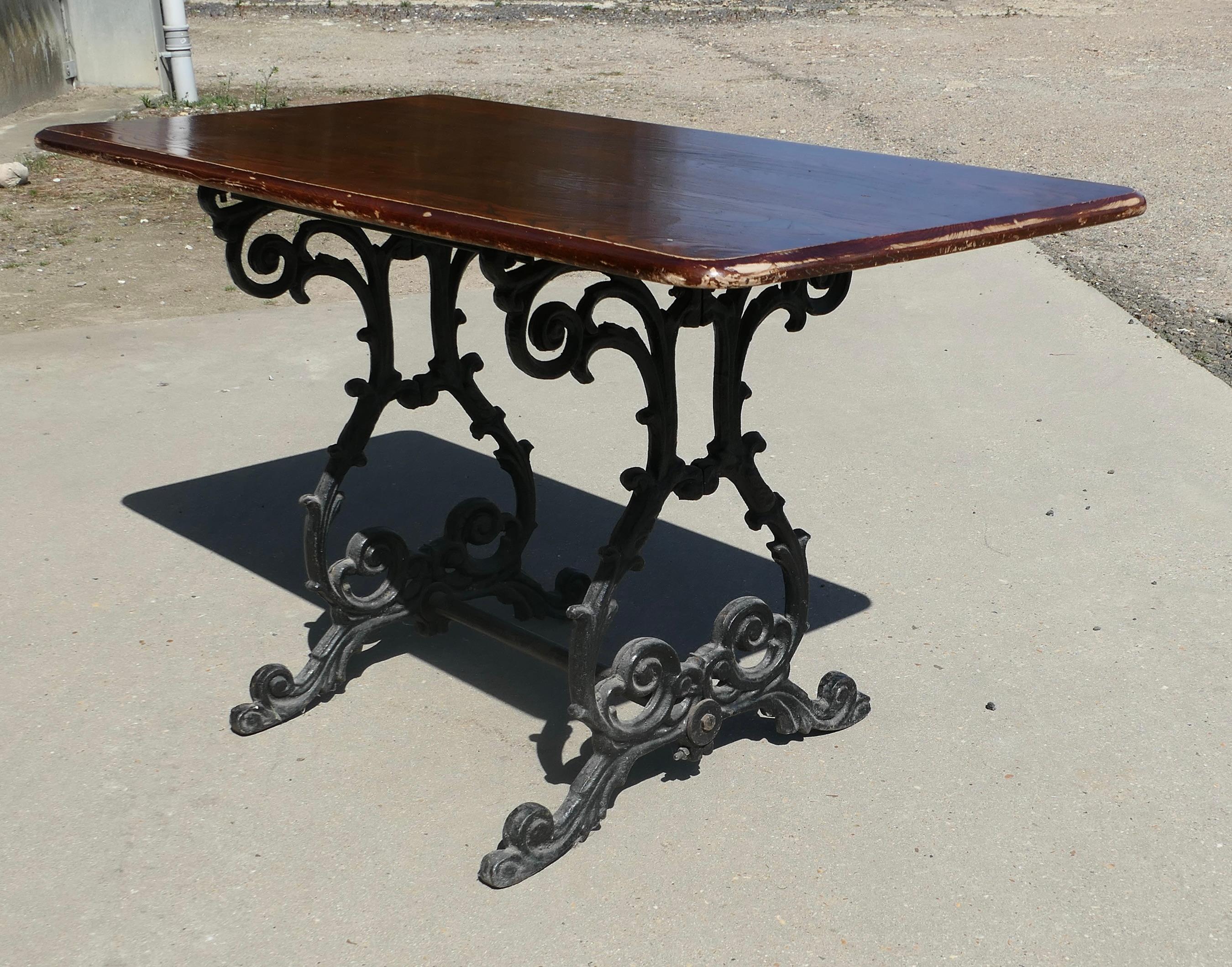 Strong Attractive Cast Iron and Oak Garden Table 

This lovely table stands on an elaborate iron base, the top of the table is made with oak
The table is in good condition with a few signs of use to the top it stands 27.5” high, 48” long and 24”