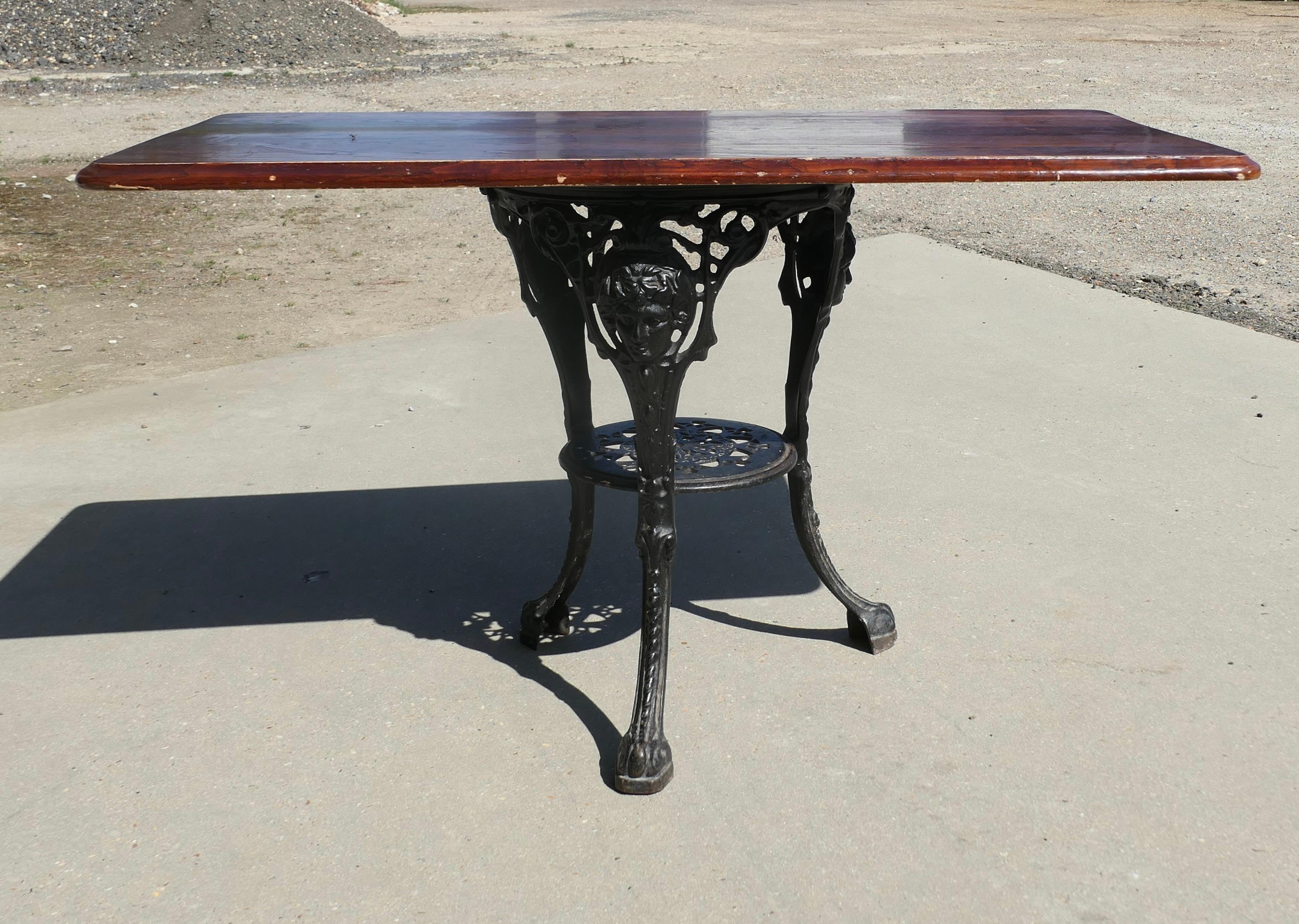 Strong Attractive Cast Iron and Oak Garden Table 

This lovely table stands on circular iron base and it has a rectangular table top made in solid oak
The table is in good condition with a few signs of use to the top it stands 28” high, 47” long and