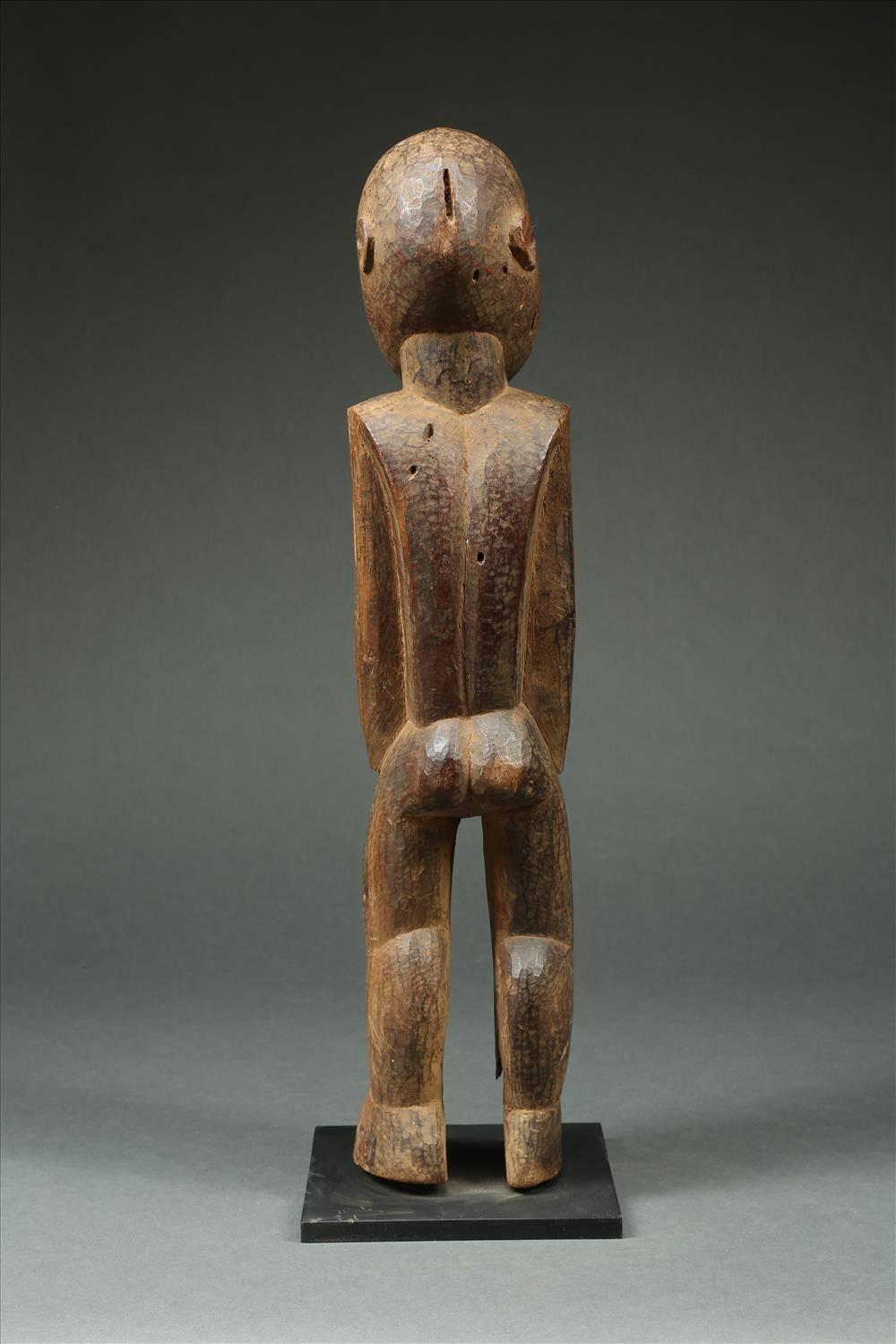 Finely carved large geometric figure from the Lobi, of Ghana and Burkina Faso, dating from the early to mid-20th century. It has a large head with projecting eyes, nose and mouth creating a captivating gaze. Carved from very hard wood with fine