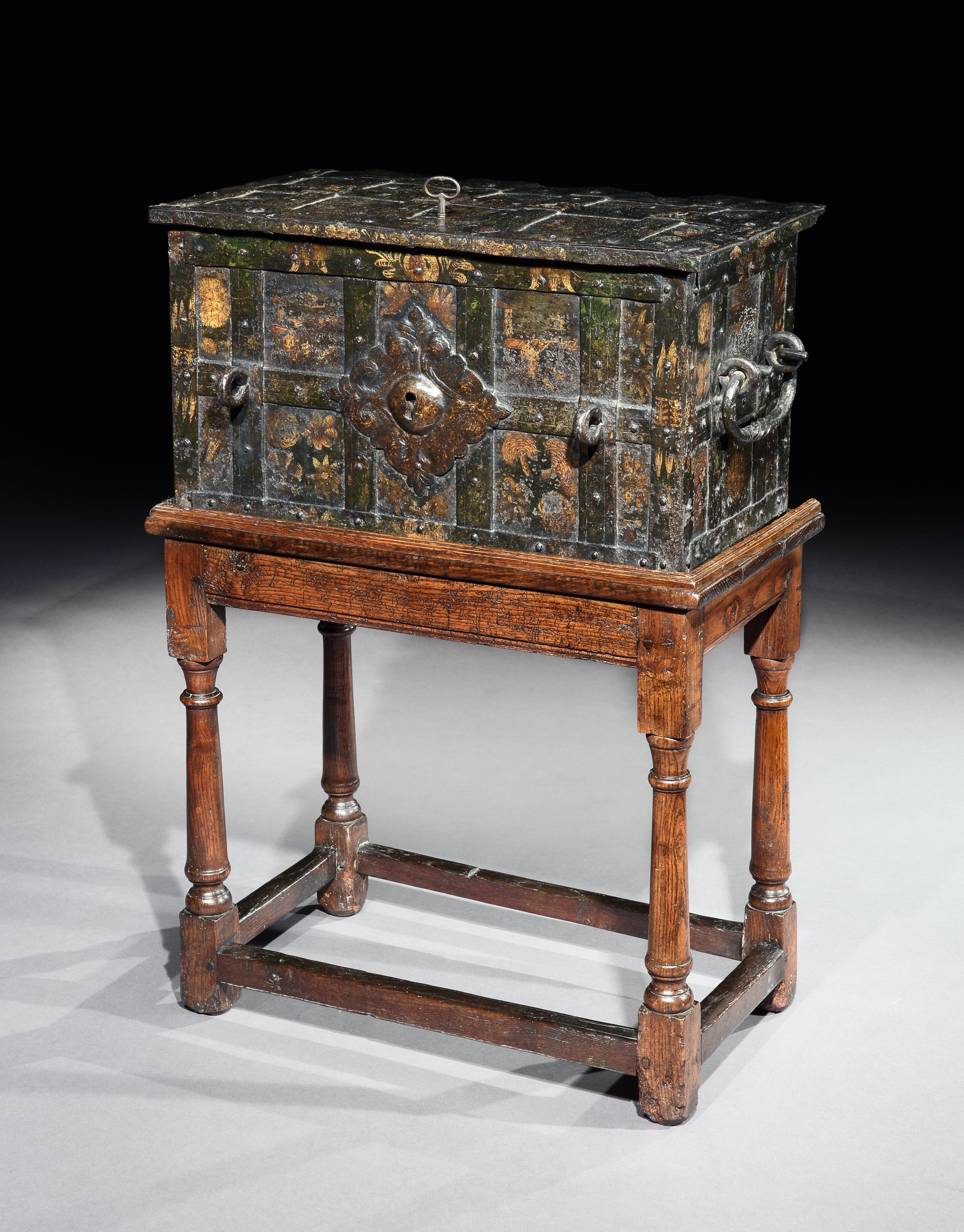 Rare, small, late-Renaissance, Nuremberg, iron, 'armada box', strongbox or travelling safe with its original, naïve, painted decoration

This is a rare, small, example of these characterful, early models of transportable safes. The much larger