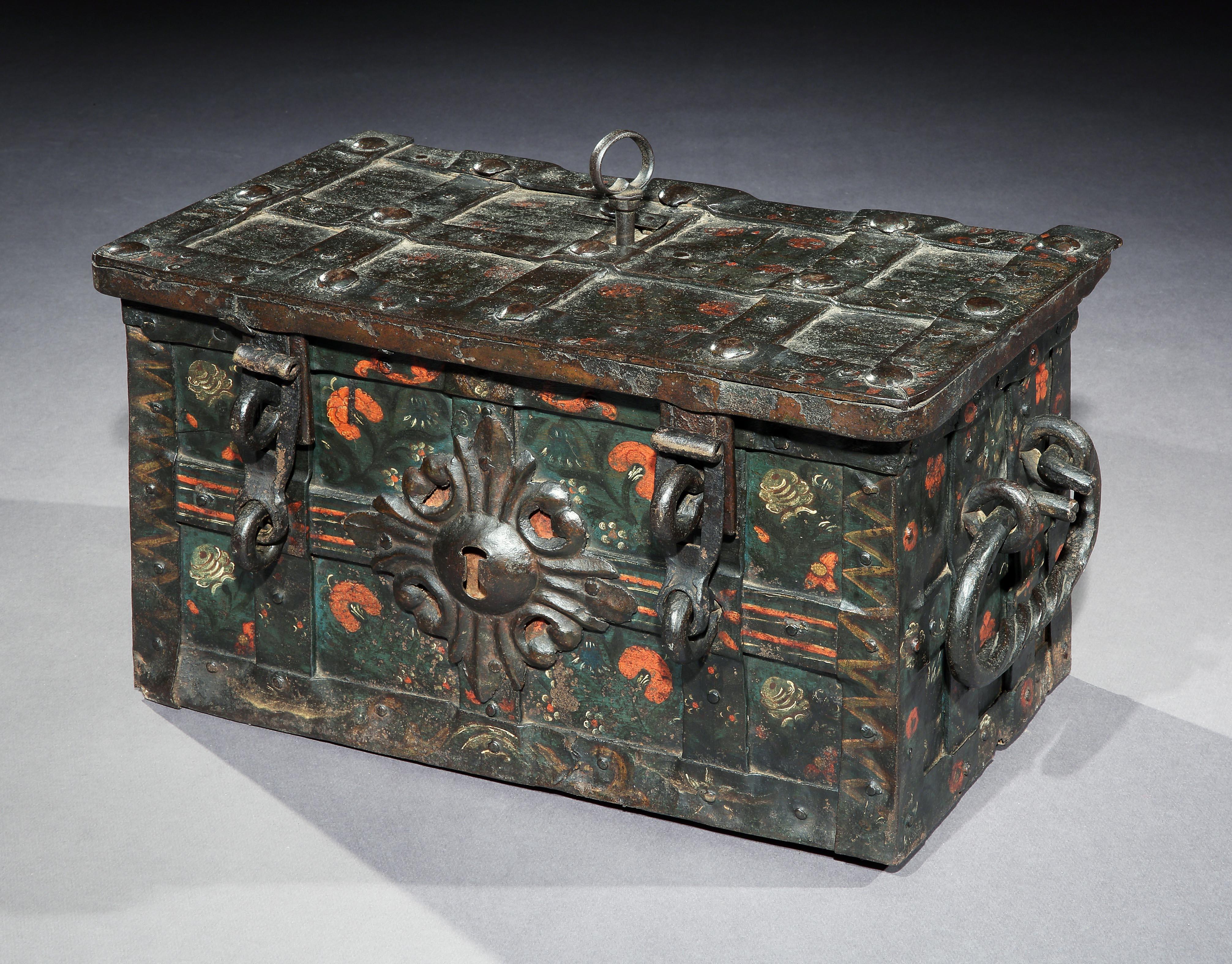 Exceptional, small, late-renaissance, table-top, Nuremberg, iron, 'armada box', strongbox or travelling safe with its original, naïve, painted decoration

This is a rare, small, table-top, example of these characterful, early models of