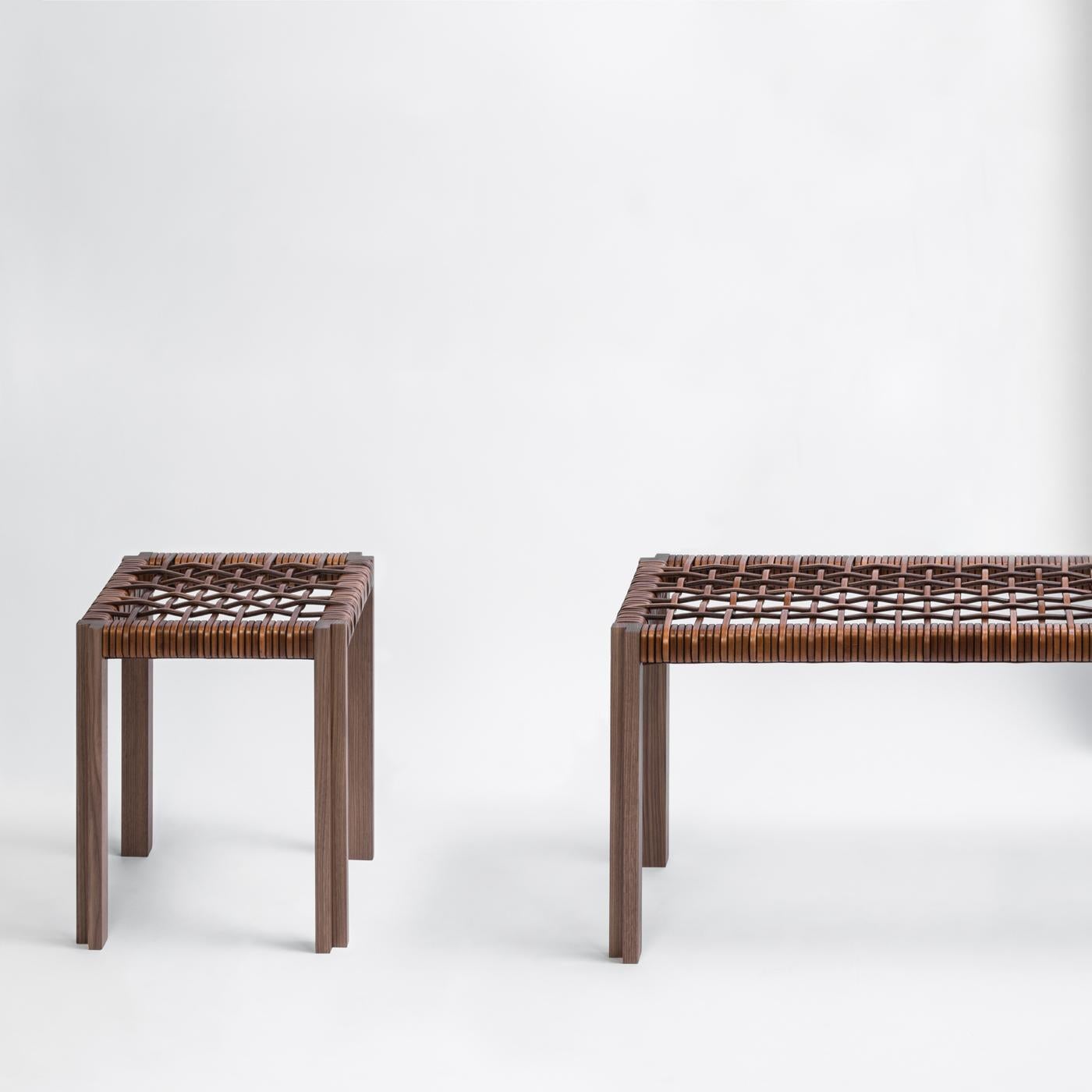 The standout element of this superb bench, part of the Structura collection, is its striking seat in interlacing leather strips. Supported by a walnut-finished wood structure and legs with L-shaped cross section, this bench will be a versatile