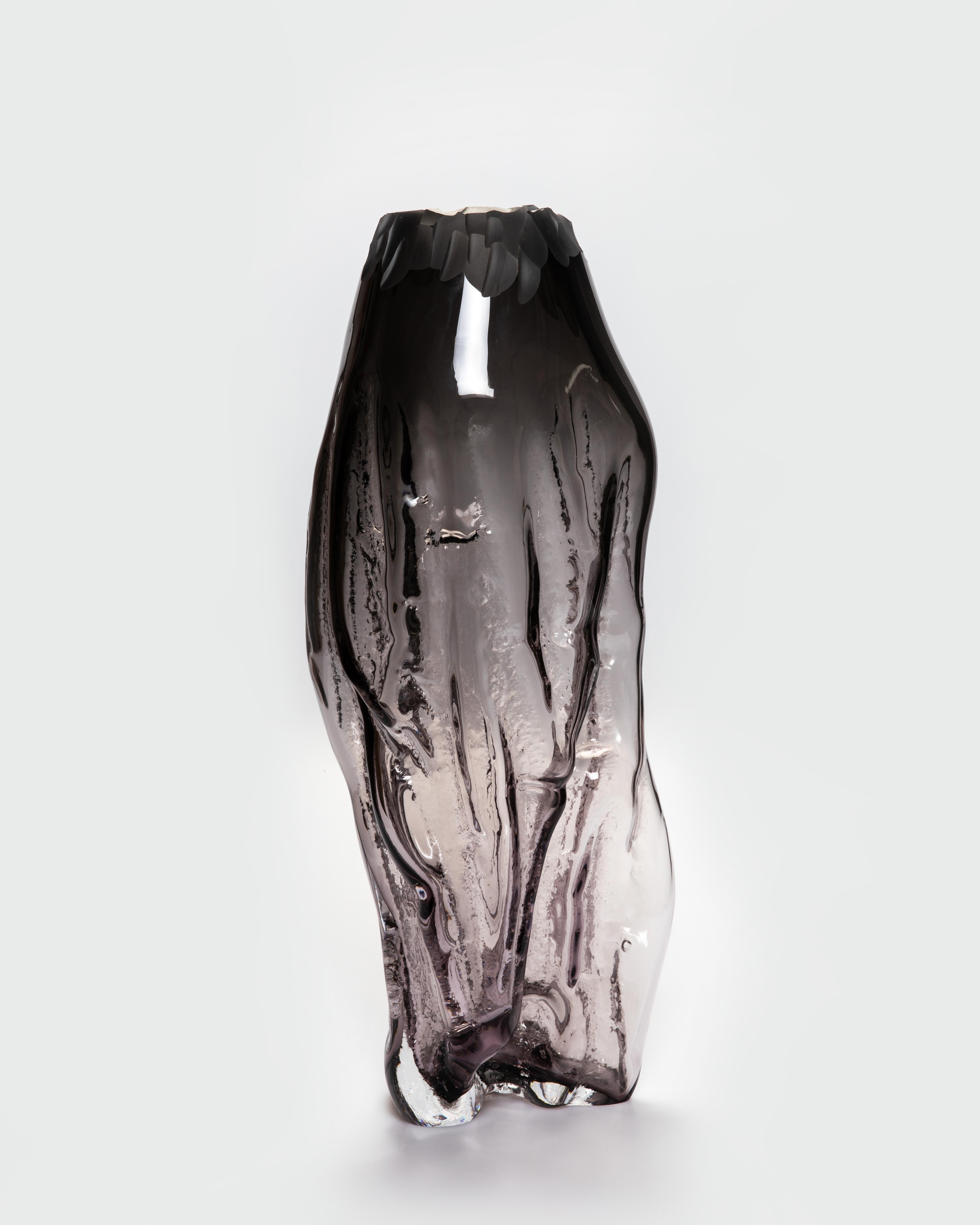 Structured By Nature Medium Vase by David Valner
Dimensions: D 22 x W 22 x H 52 cm.
Materials: Glass.
Weight: 8 kg.
Finish: Medium-size “branches” production style, smoke color.

“Authentic imprints of the Czech nature in glass.”

Structured by