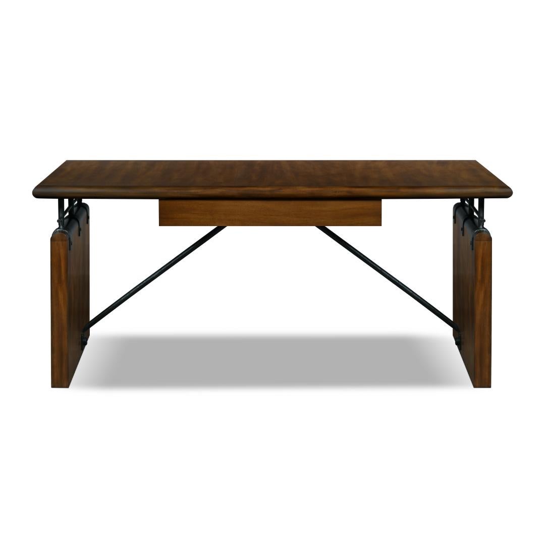 The mix of primavera wood and metal give the Roda writing table a structured appearance. Its table top is supported by iron anchors that feed into a rectangular wooden base and it has a drawer in the center.
