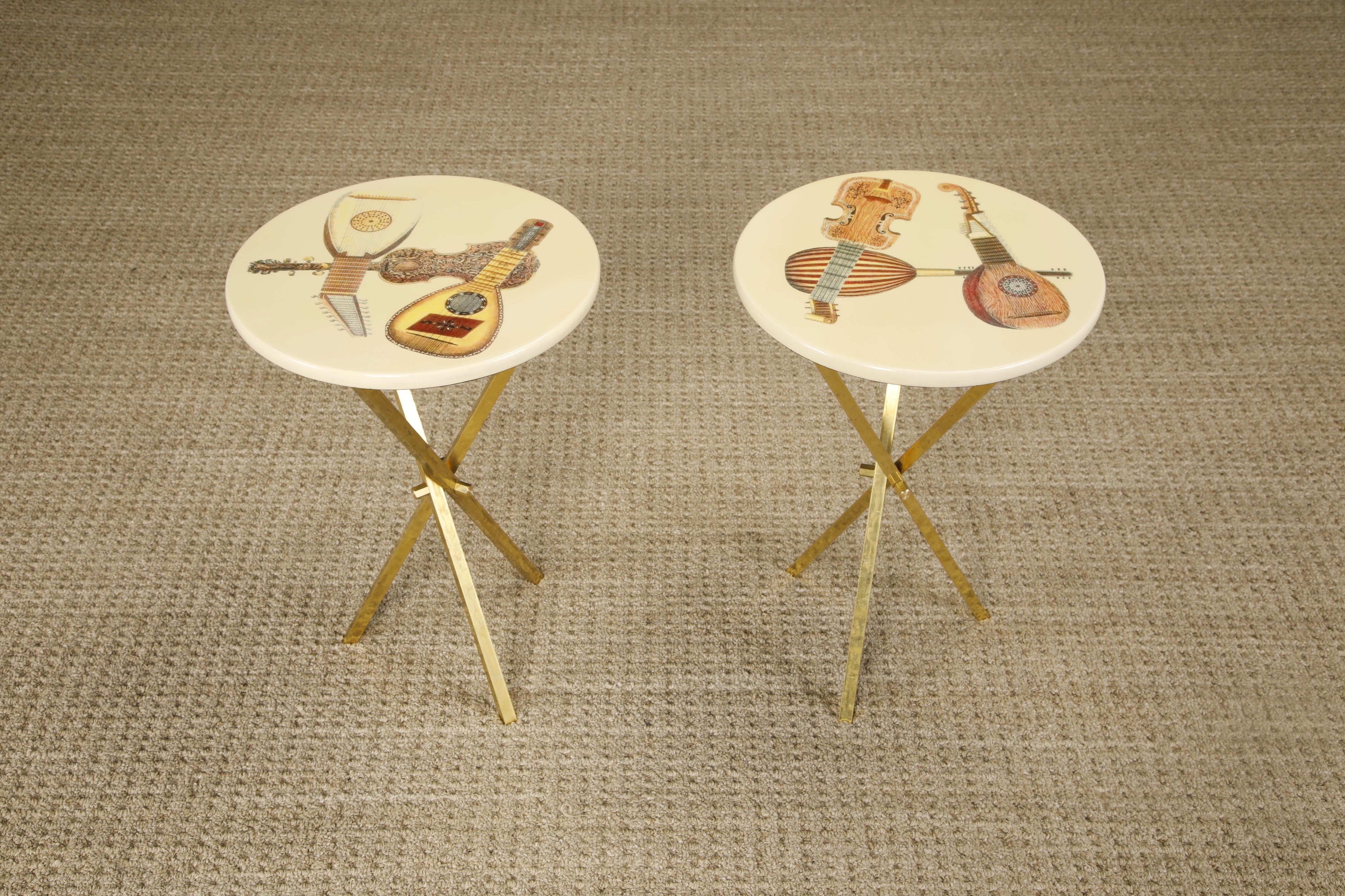 These gorgeous collectors items are the 'Strumenti Musicali' (Musical Instruments in Italian) side tables by Piero Fornasetti, signed underneath with original labels. Priced individually, we have two available. 

This pair of drinks / side tables