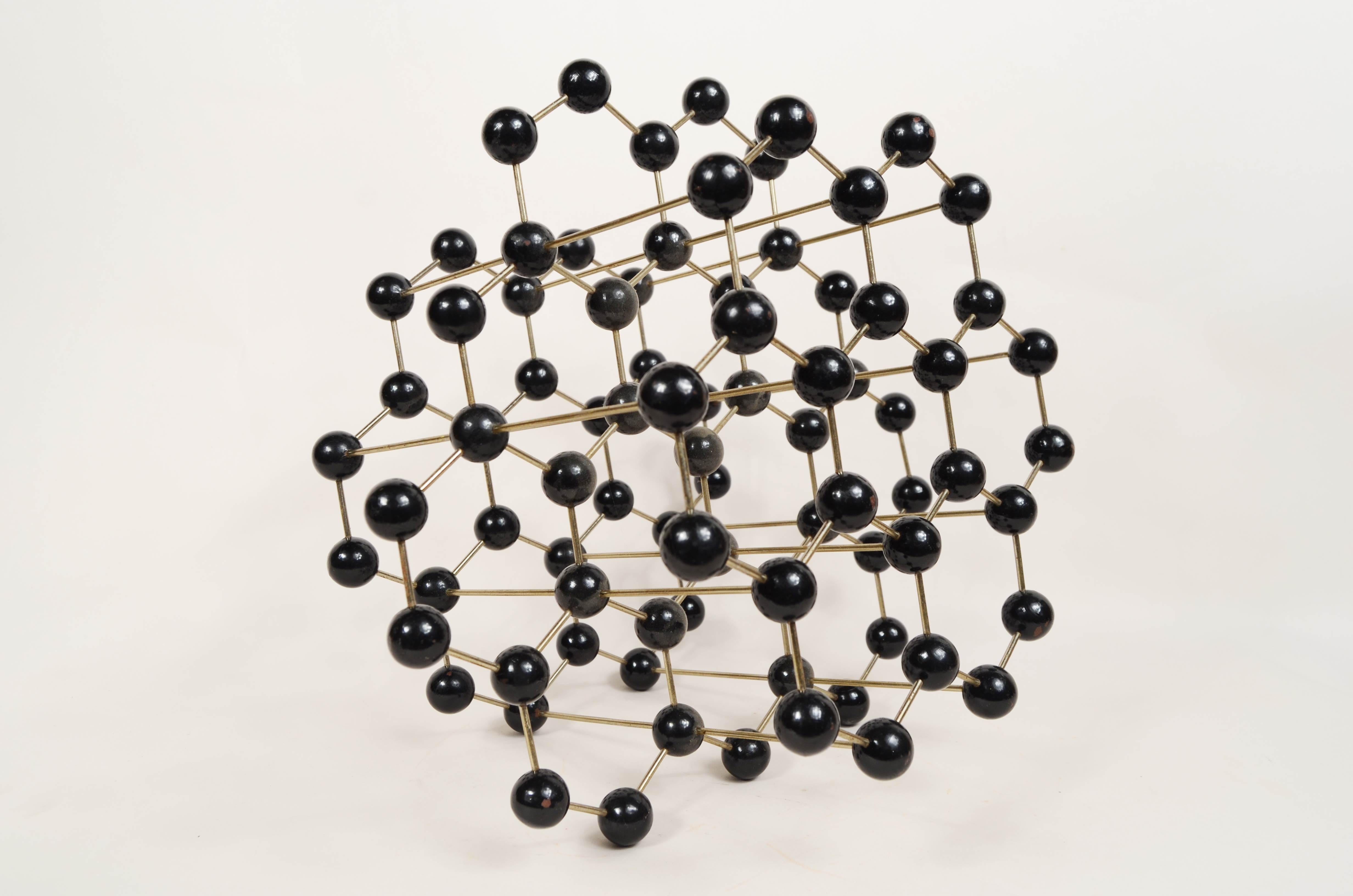 Atomic structure for educational use of graphite made  metal with black Bakelite spheres. Czechoslovakian manufacture of the 1950s. 
Good  condition, Measures 28x28x20 cm - inches 11x11x7.9. 
Graphite is a mineral that represents one of the states