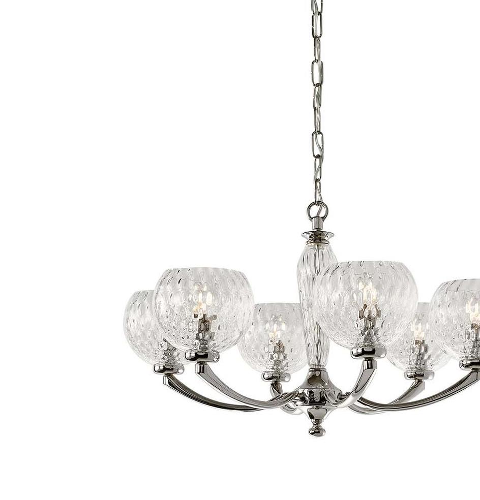 A testament to expert craftsmanship and traditional excellence, this sophisticated chandelier will stand out in any interior with understated elegance. Crafted of metal with a polished nickel finish, the simple structure features six-curved arms