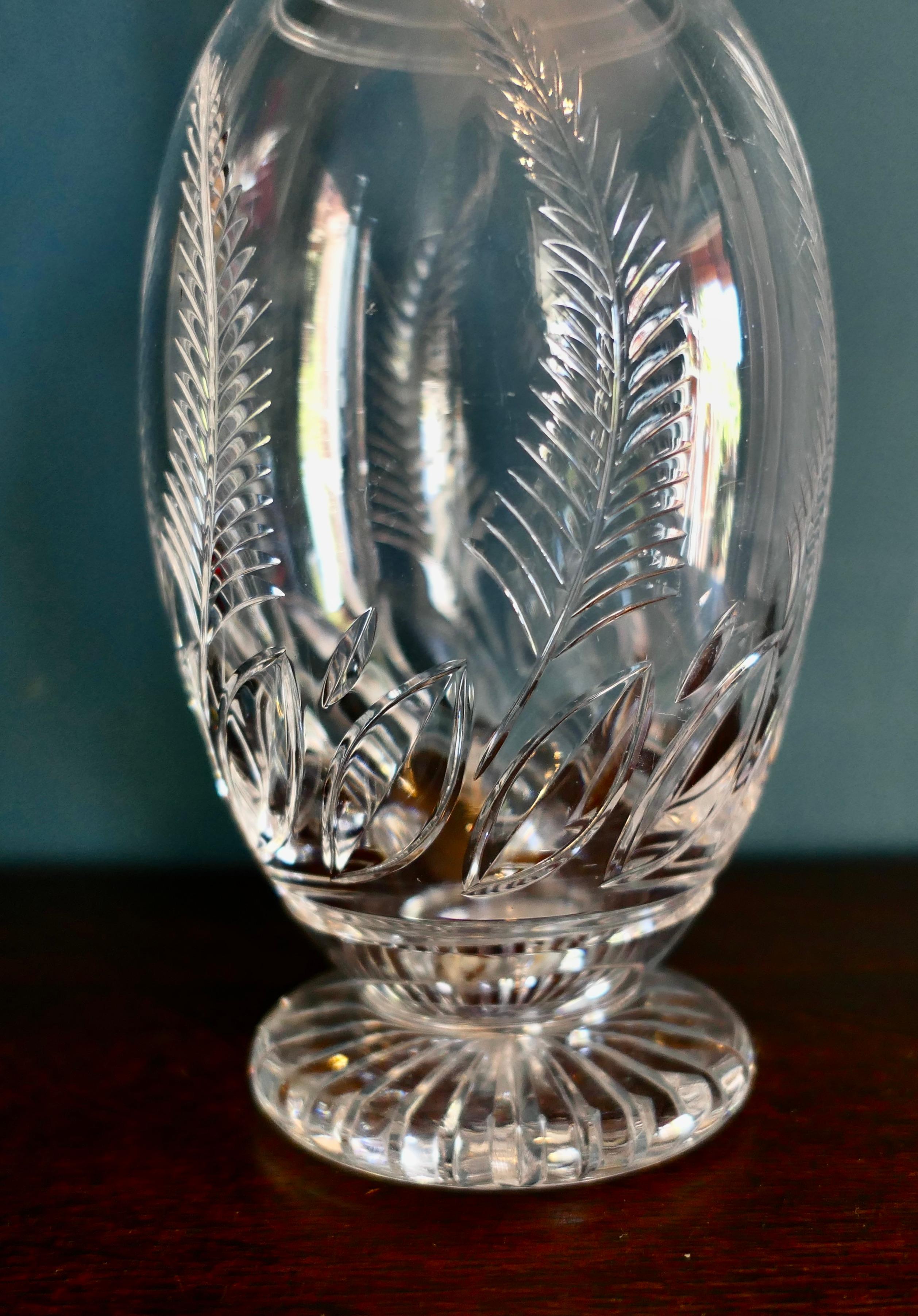 Stuart crystal round footed decanter Ellesmere pattern.

A Classic of its time the lovely piece is in good condition, and one of the loveliest of The Stuart designs dating from the middle of the 20th century.
The item is signed 
