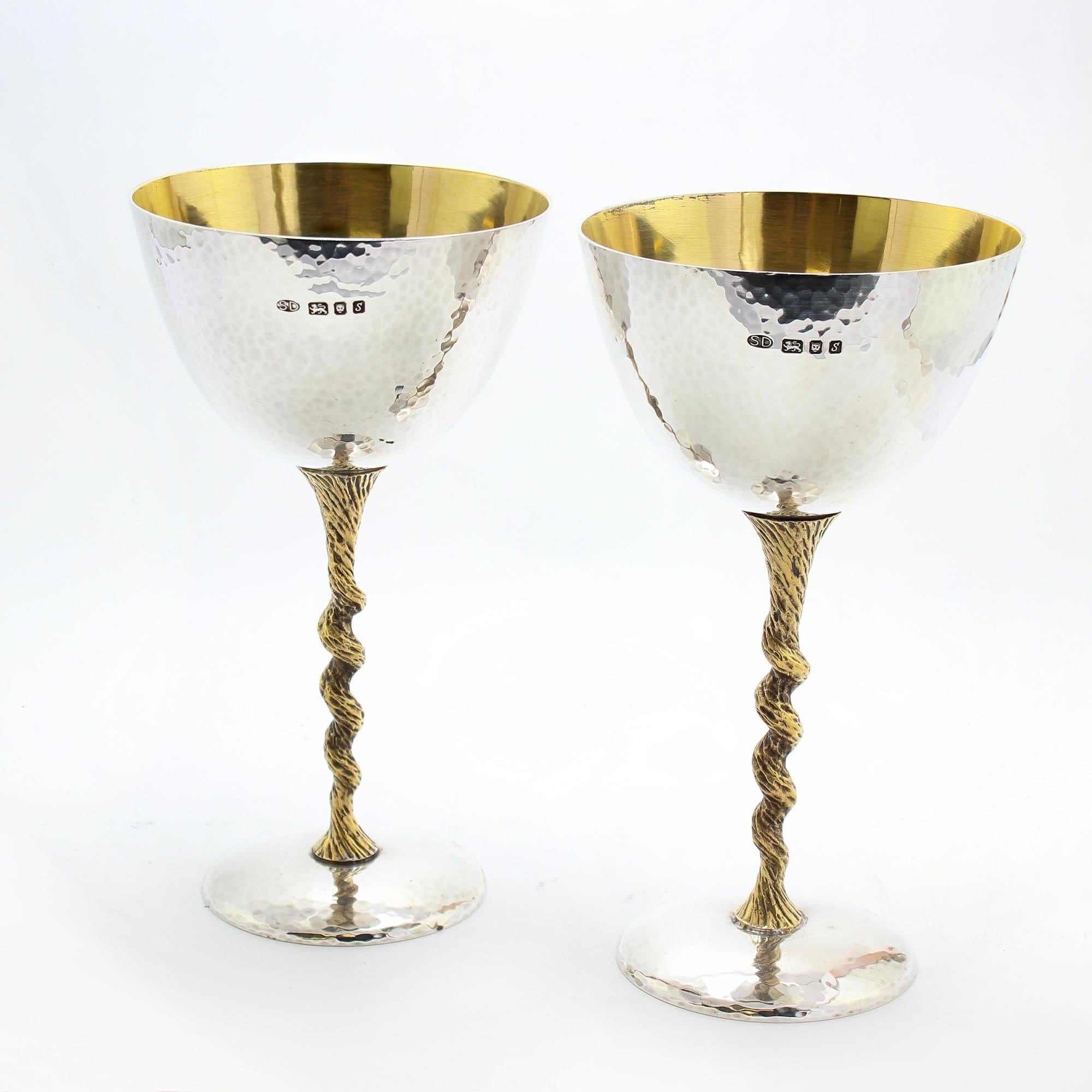 Sophistication from the 1970s, these sterling silver champagne flutes bear designs by the legendary Stuart Devlin.
Stuart Devlin's work can be found in award-winning hotels and restaurants around the world.

A stunning and refined addition to