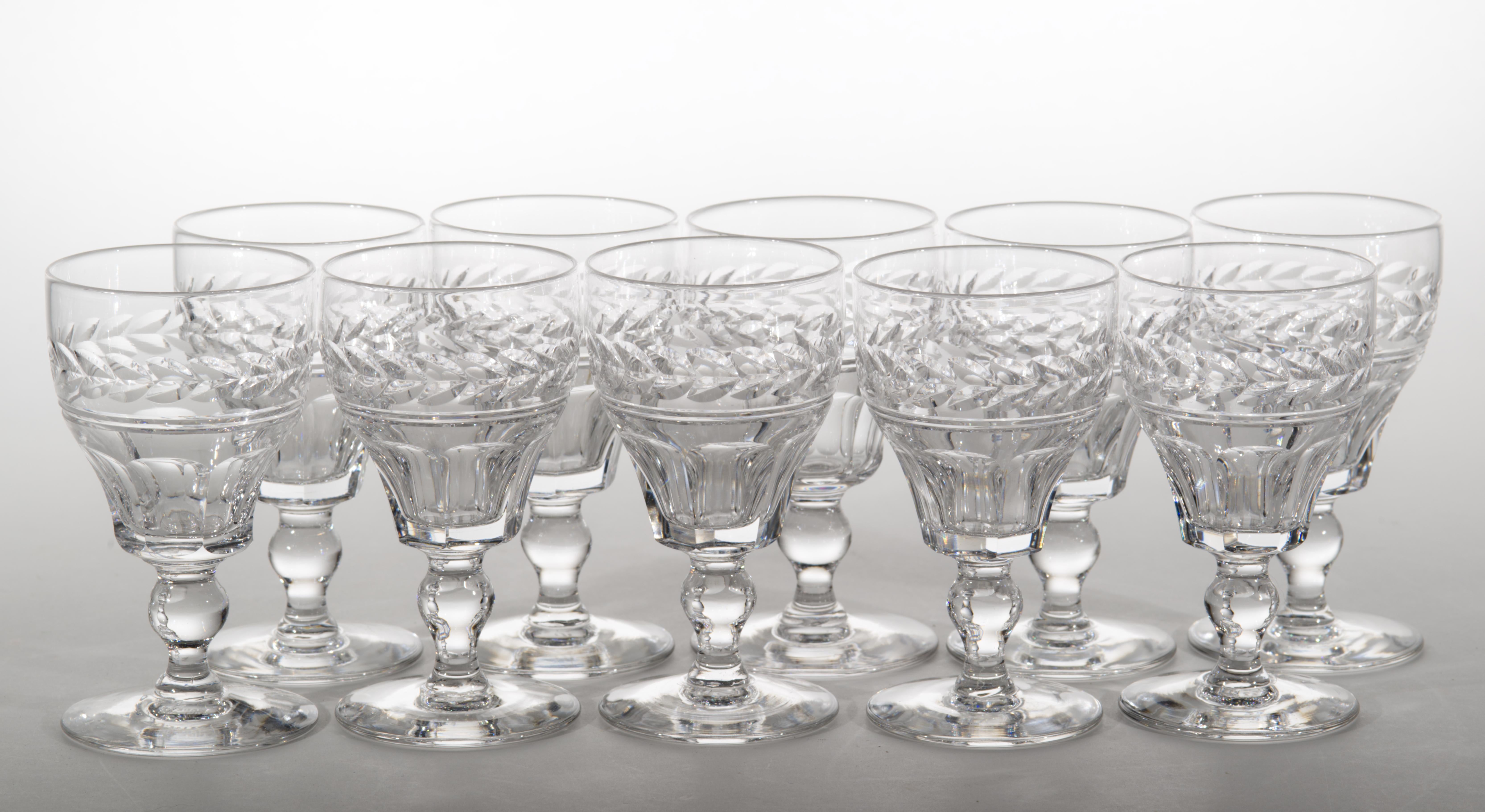  Vintage handmade Stuart crystal sherry, liqueur, or dessert wine glasses feature a band of cut abstract leaf shapes and cut panels on bowl in Arundel pattern, sculptural short stems with a little ball inclusion, and wide, stable round