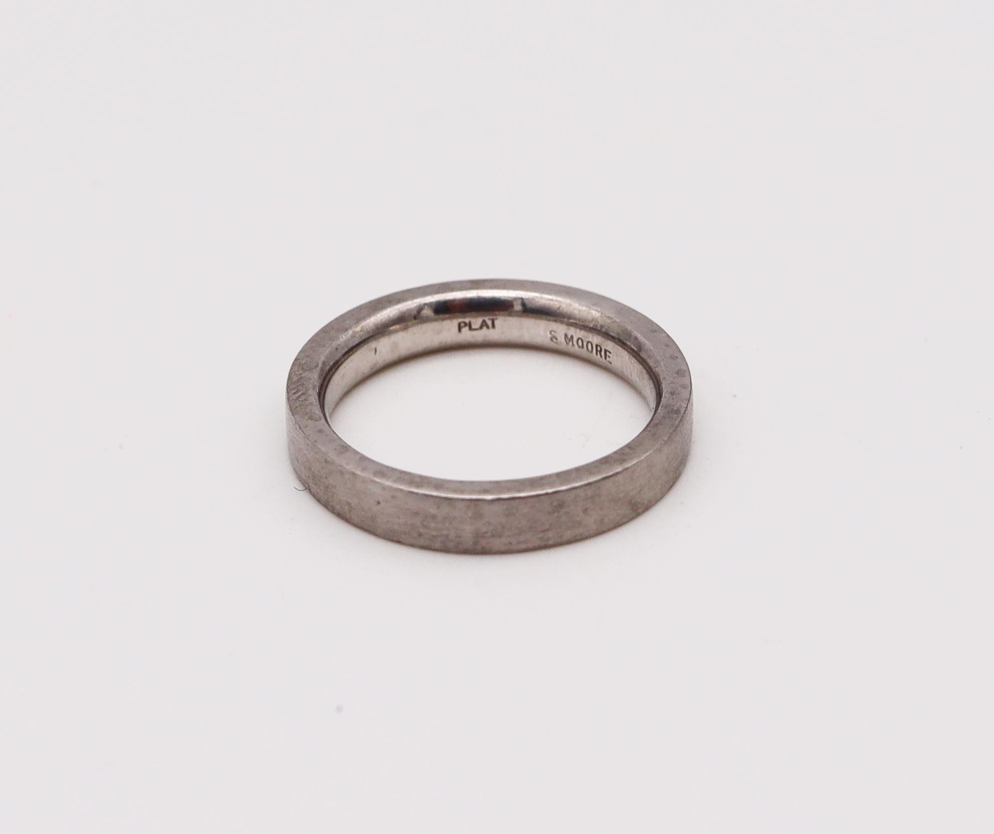 Wedding band ring designed by Stuart Moore.

Beautiful ring, created at the atelier of Stuart Moore in solid .950/.999 platinun with the surfaces treated with a delicate brushed finish. The design is based in the parameters of the bauhaus school