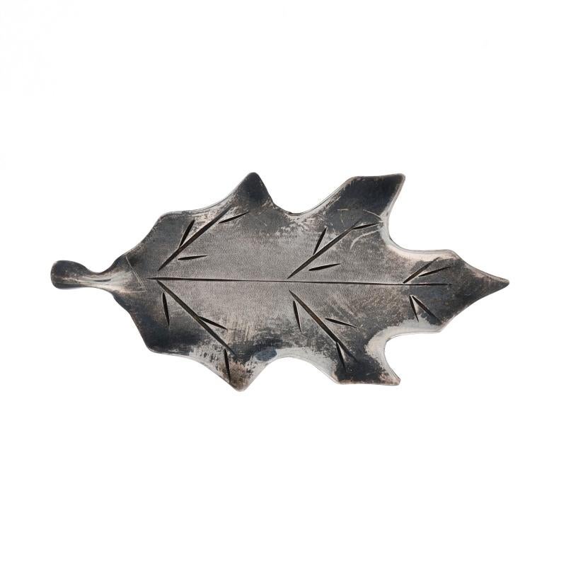 Brand: Stuart Nye

Metal Content: Sterling Silver

Style: Brooch
Fastening Type: Hinged Pin and Whale Tail Clasp
Theme: Oak Leaf, Nature

Measurements

Tall: 27/32