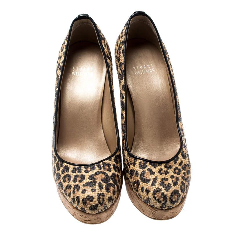 Made from raffia, these pumps add an edge to your personality. Featuring espadrille wedges and platforms, this Stuart Weitzman pair is fashioned in a lovely silhouette with leather-lined insoles. This pair of beige pumps are complete with a leopard