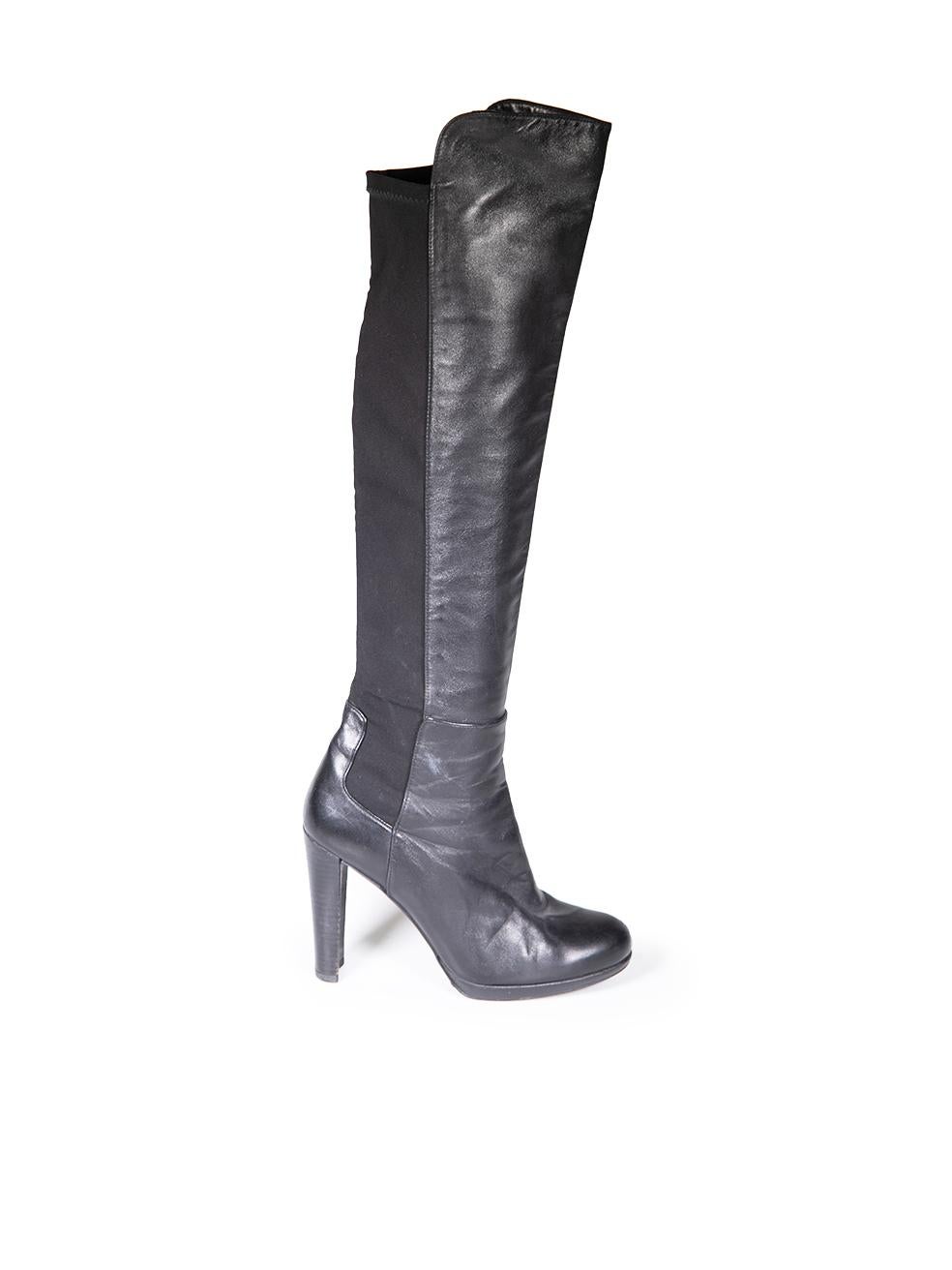 CONDITION is Very good. Minimal wear to the boots is evident. Abrasion to the all areas of both shoes and both heels. Pluck to the weave on the right side of the left shoe and the left side of the right shoe on this used Stuart Weitzman designer