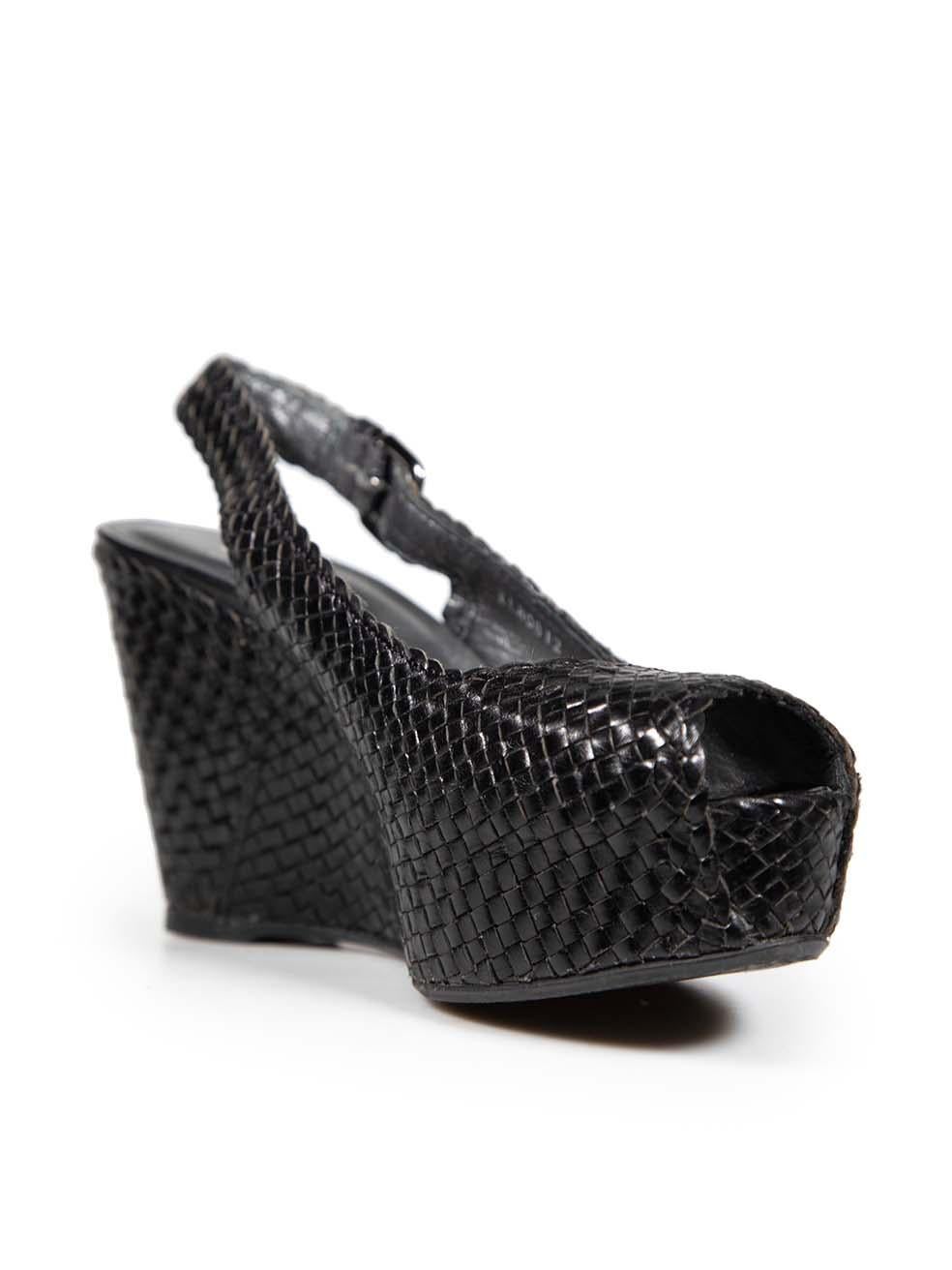 CONDITION is Very good. Minimal wear to the heels is evident. Abrasion to both insoles. Inconsistency to the weave at the top of both heels on this used Stuart Weitzman designer resale item.
  
  Details
  
  
  Black 
  
  Leather 
  
  Sandals 
 
