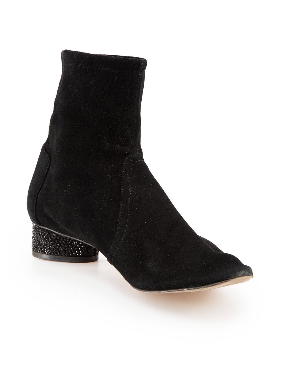 CONDITION is Very good. Minimal wear to boots is evident. Minimal wear to the left boot heel with abrasions to the suede on this used Stuart Weitzman designer resale item.

Details
Black
Suede
Ankle boots
Round toe
Embellished heel
Slip on
Made in