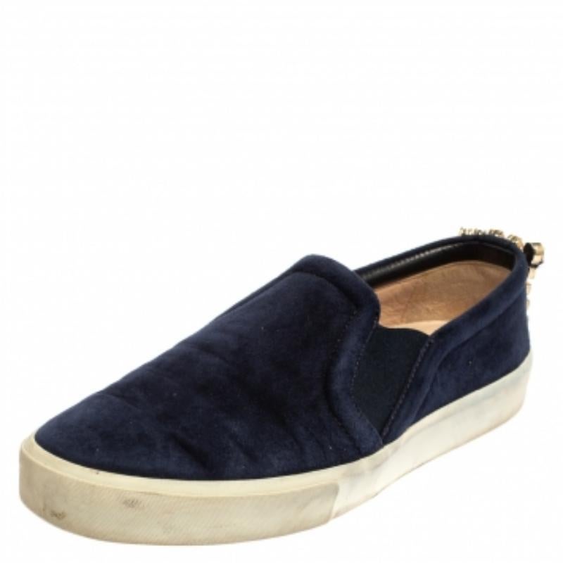 Ready to offer comfort and style, this pair of sneakers by Stuart Weitzman will make a fantastic addition to your shoe collection. They've been crafted from blue suede and styled with crystal details on the counters. They are complete with white