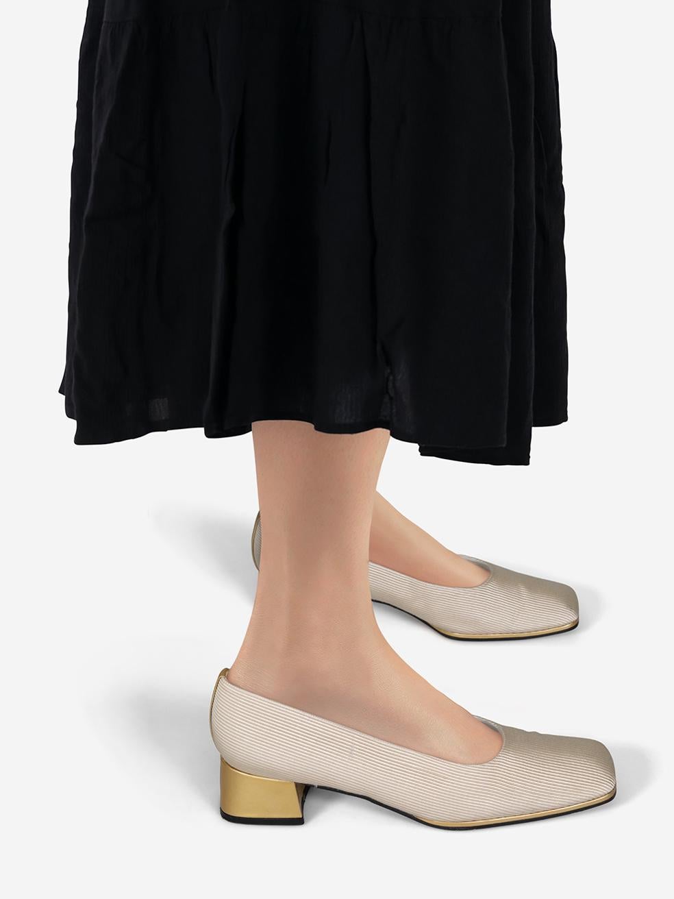 CONDITION is Very good. Minimal wear to the pumps is evident. Abrasion on the right heel. Marks on both toe boxes, left side of the left shoe and right side of the right shoe on this used Stuart Weitzman designer resale item.
 
 Details
 
 
 Cream
