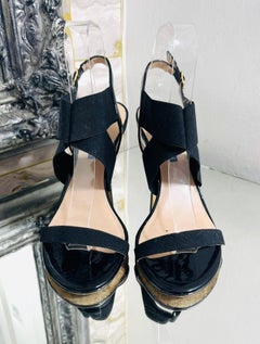 Stuart Weitzman Cross Strap Patent Leather Sandals