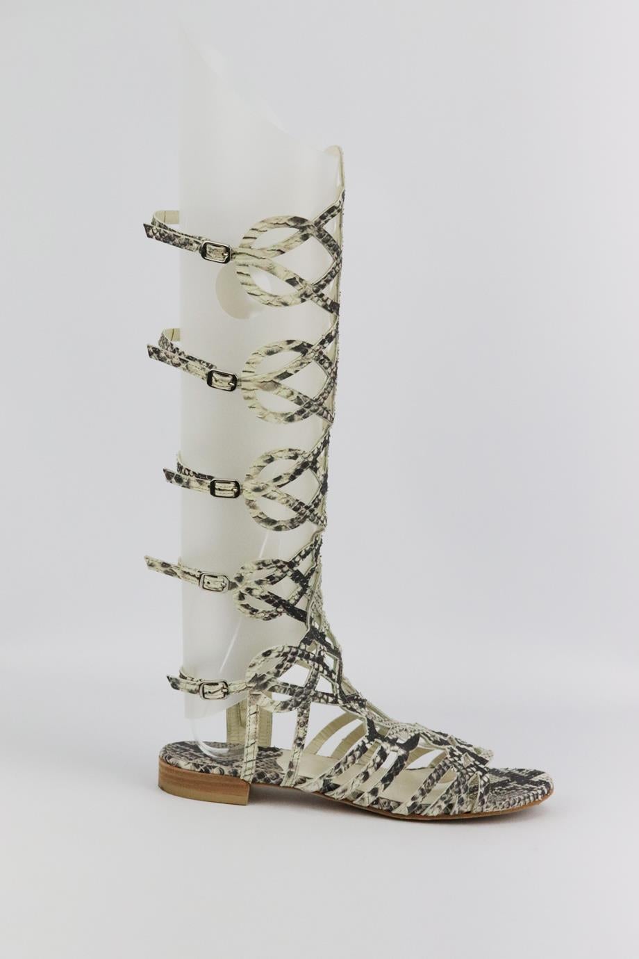 Stuart Weitzman cutout snake effect leather sandals. Made from tonal-grey snake-effect leather in a cutout design. Tonal-grey. Zip fastening at side. Does not come with box and dustbag. Size: EU 37 (UK 4, US 7). Shaft: 14.5 in. Insole: 9.5 in. Heel: