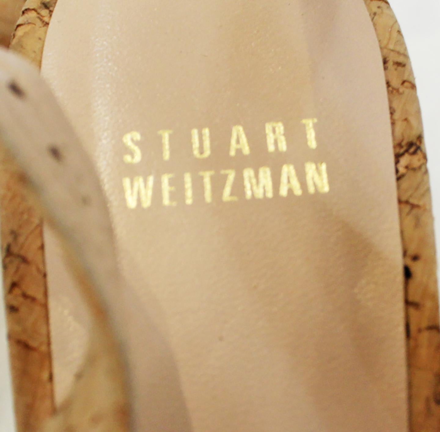Stuart Weitzman Decoslinky cork wedge shoes on the uppers and the wedge heels are lined in beige leather.  It includes adjustable buckle slingback strap.  These wedges contain 2 3/4