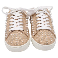 Mules Goldie di Stuart Weitzman in rafia beige